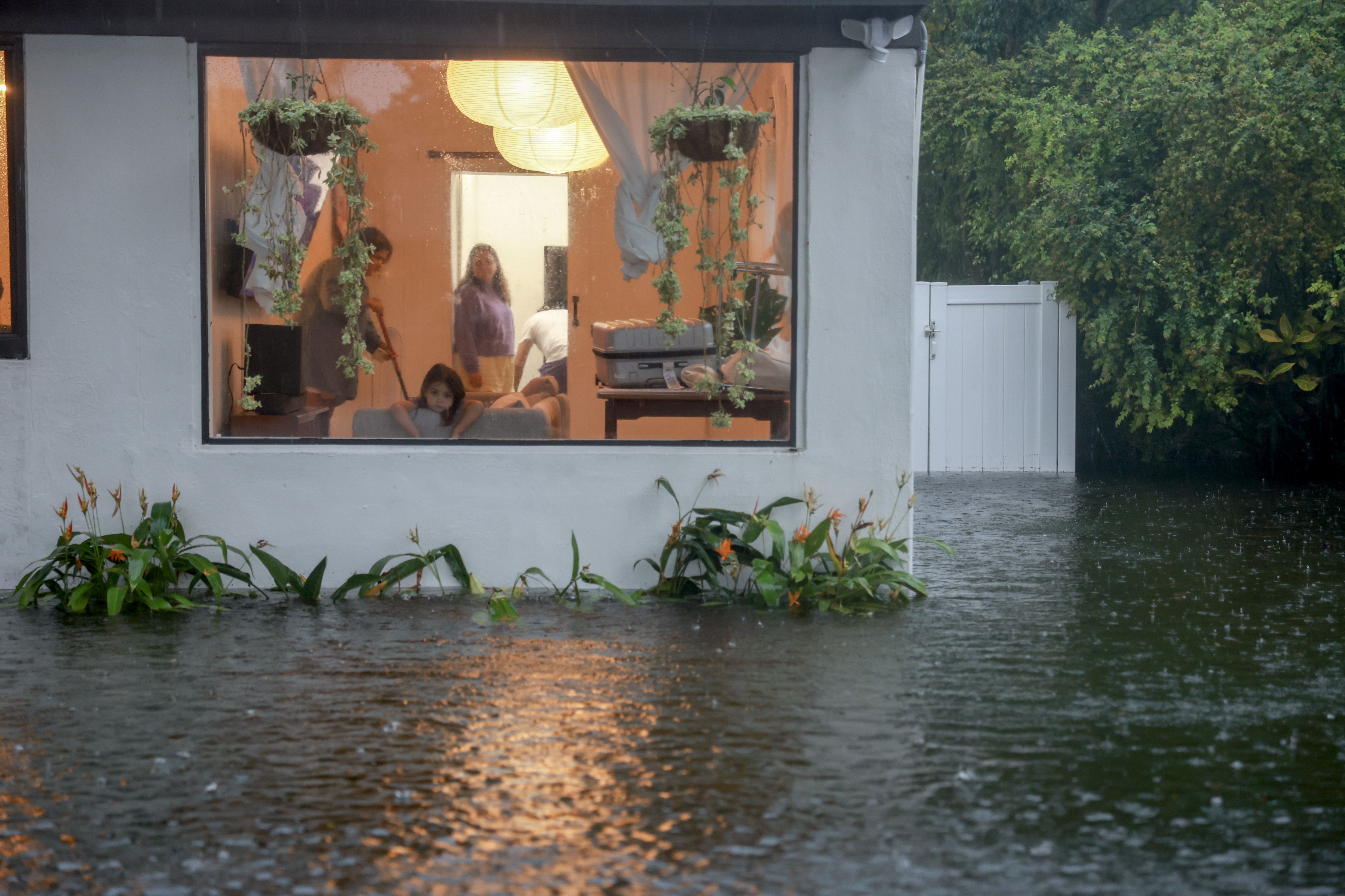 Flood waters surround a home on June 12, 2024, in Hollywood, Florida. 