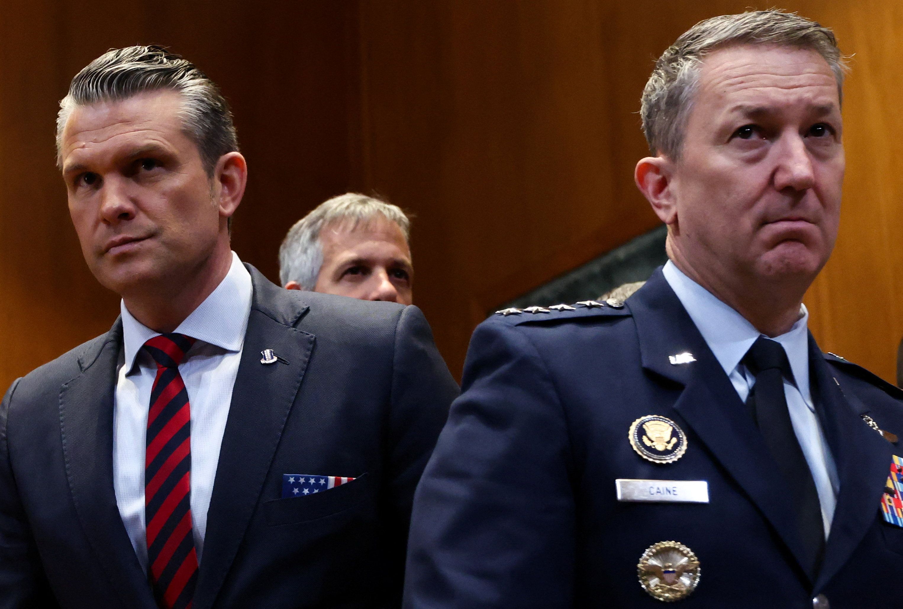 Defense Secretary Pete Hegseth and Joint Chiefs of Staff Chairman Dan Caine arrive to testify before a Senate Appropriations subcommittee yesterday,