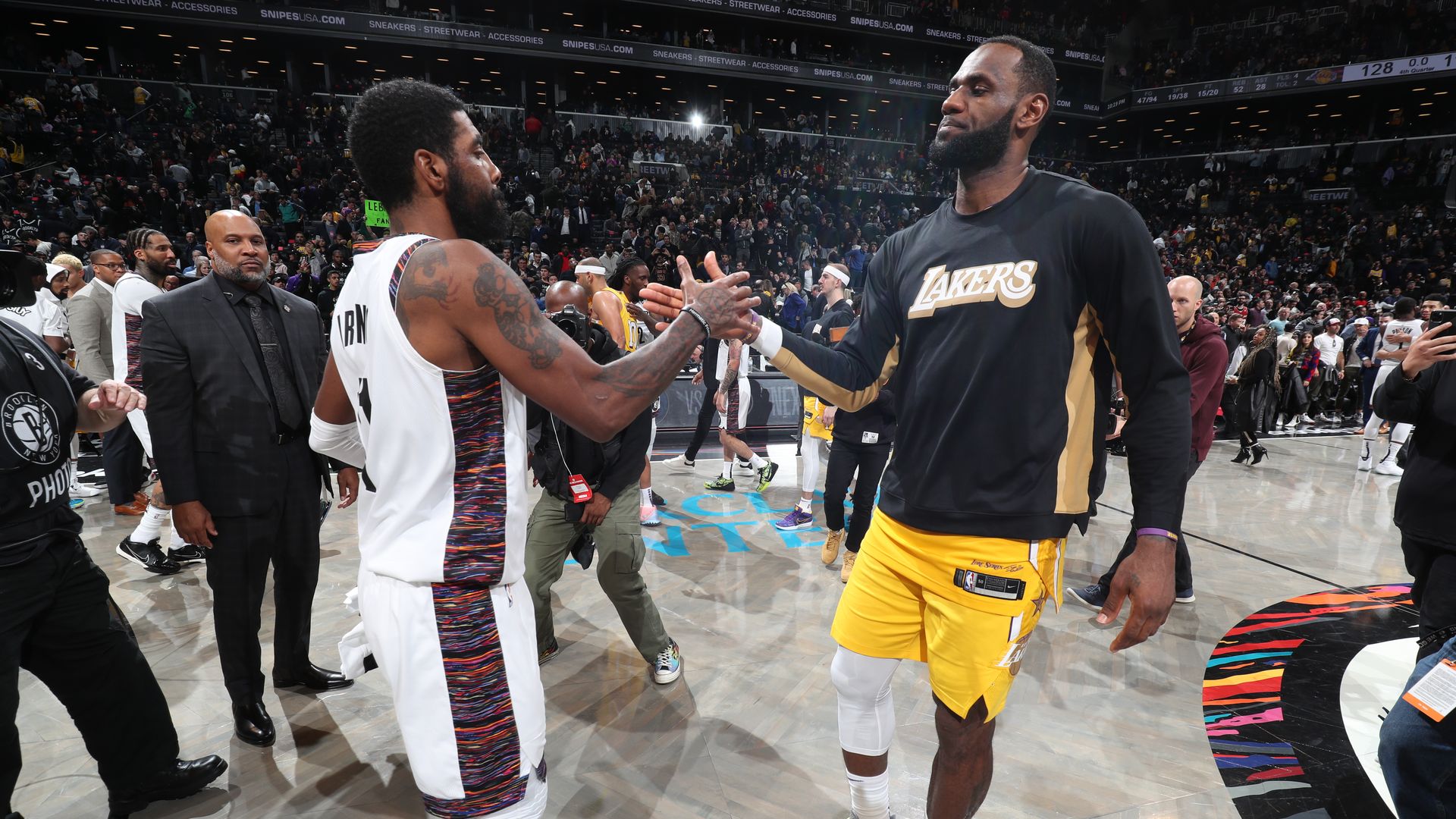 Kyrie Irving #11 of the Brooklyn Nets and LeBron James #23 of the Los Angeles Lakers hi-five after a game on January 23, 2020.