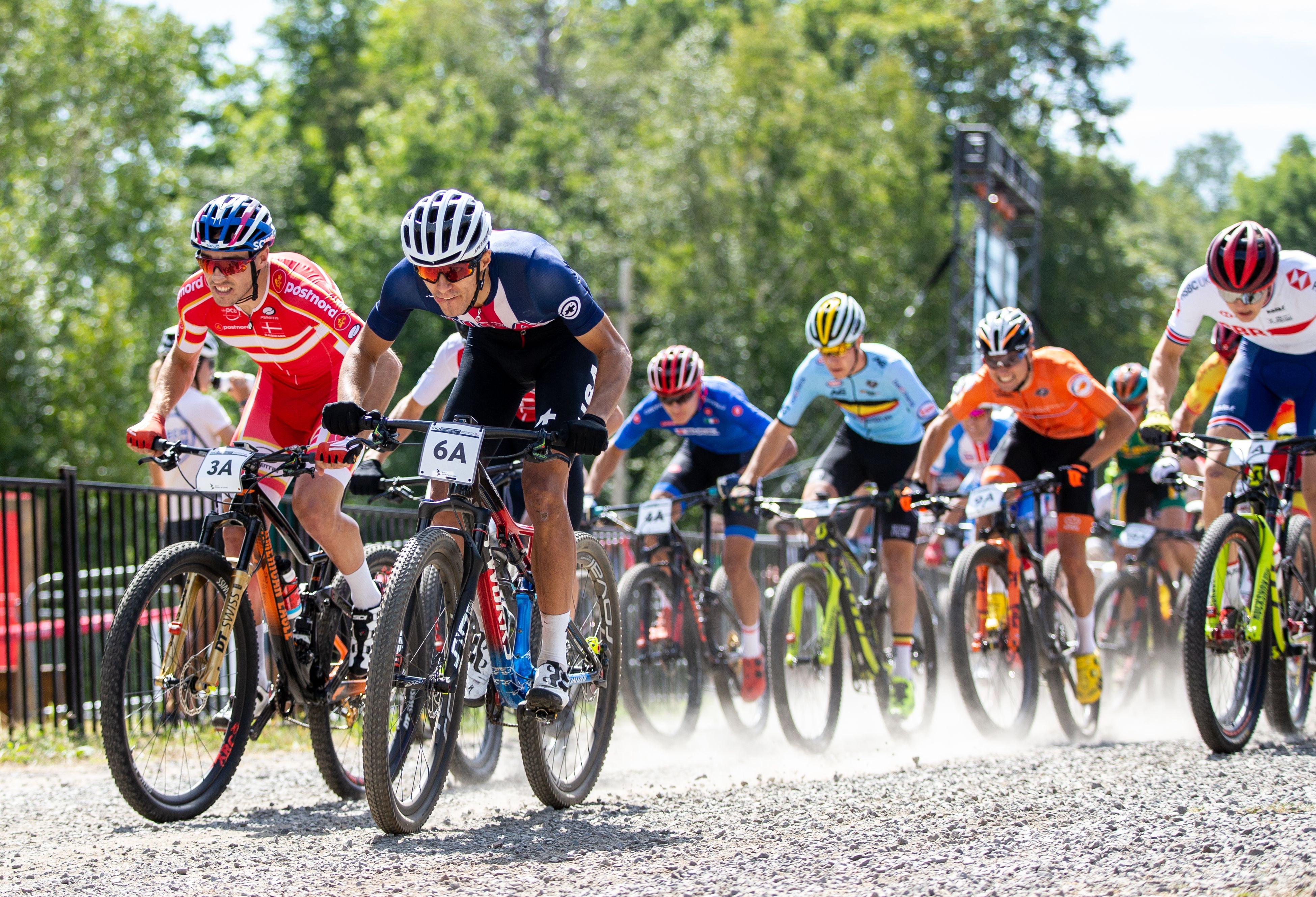 Christopher Blevins, center in navy, at the cross-country team relay at the UCI Mountain Bike World Championships in 2019. 