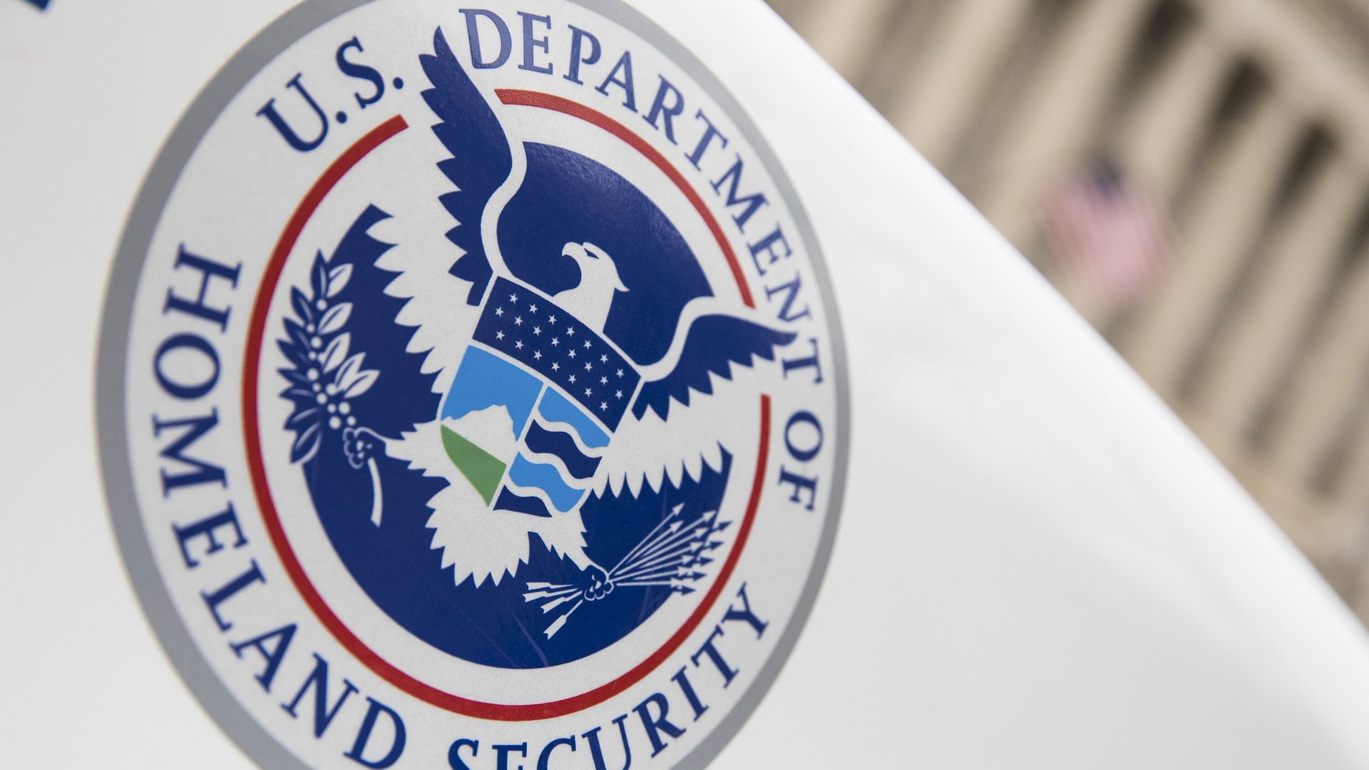 The Department of Homeland Security logo is seen on a law enforcement vehicle