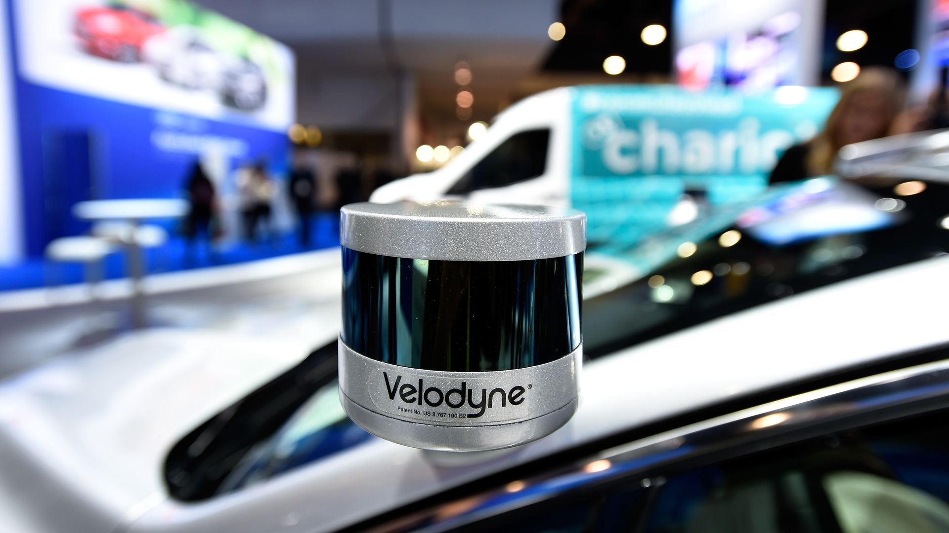 A Velodyne LiDAR sensor is mounted on a Ford Fusion hybrid