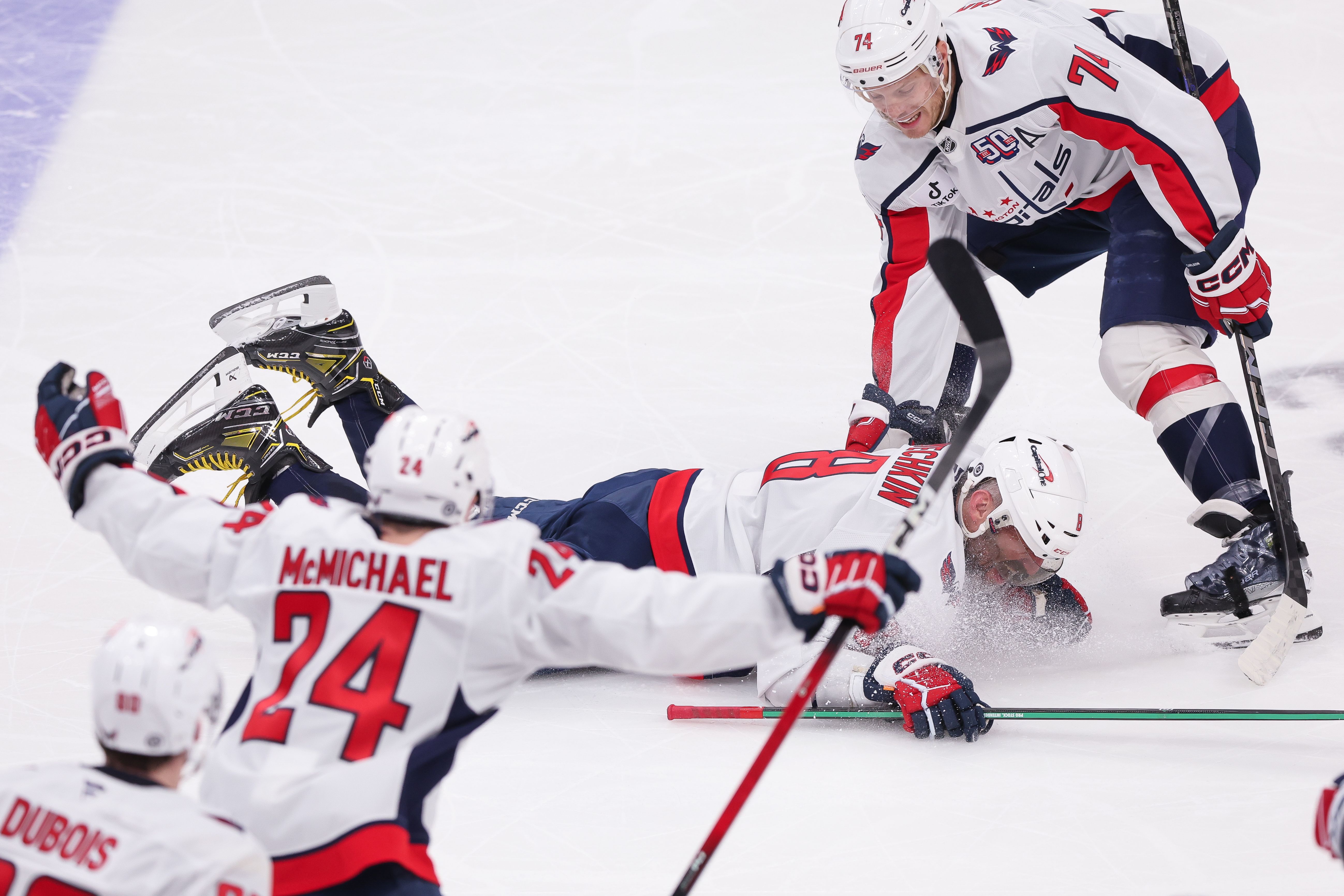 Alex Ovechkin celebrates with teammates after record-breaking goal