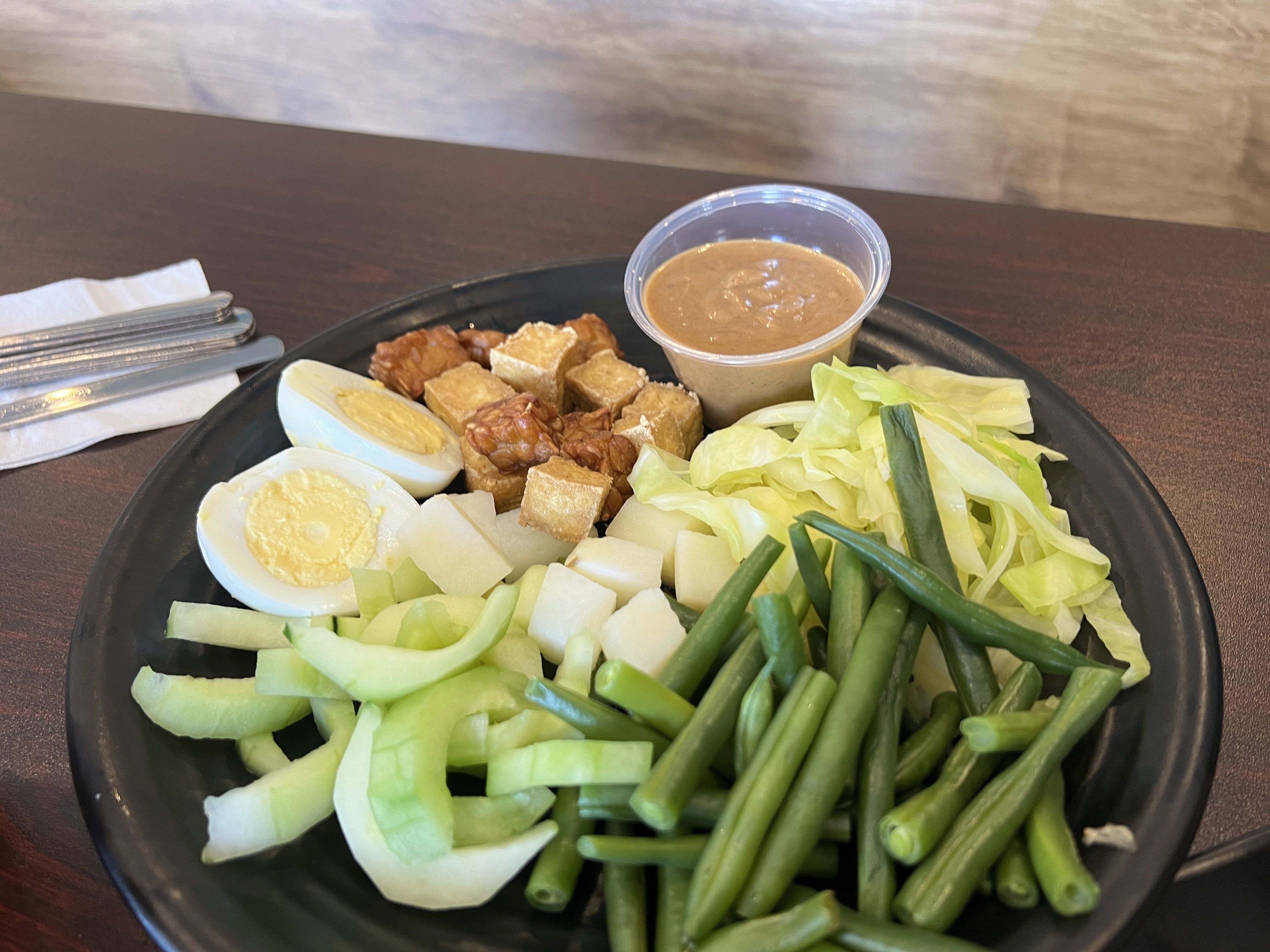 dish with green beans, boiled eggs, tofu and cucumber