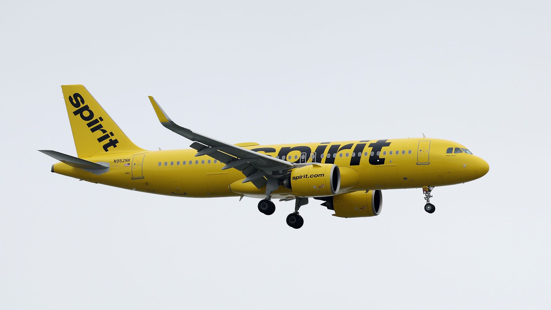 A Spirit Airlines plane lands at Oakland International Airport on July 28, 2022 in Oakland, California