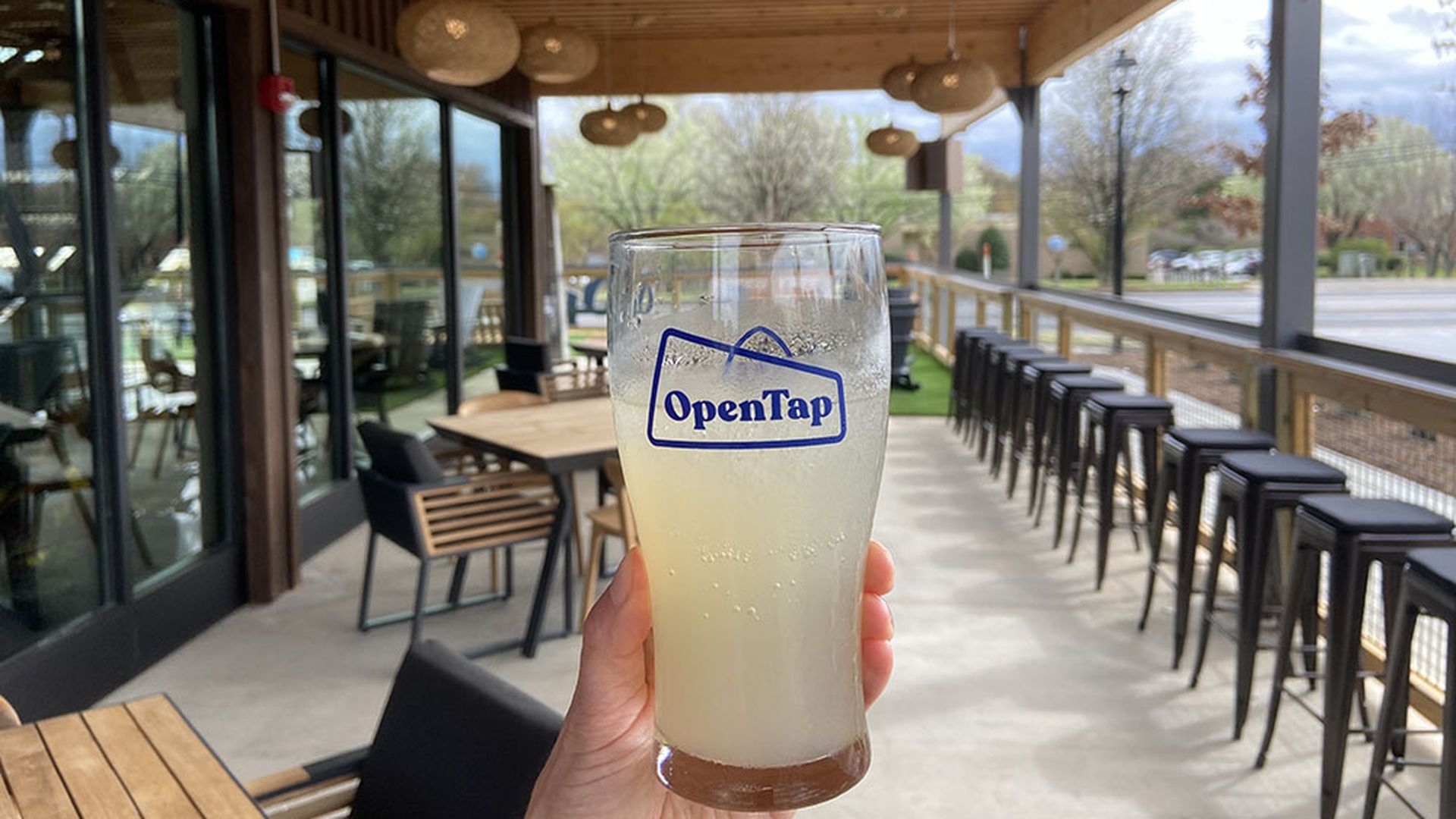 An OpenTap bar glass on a sunny patio.