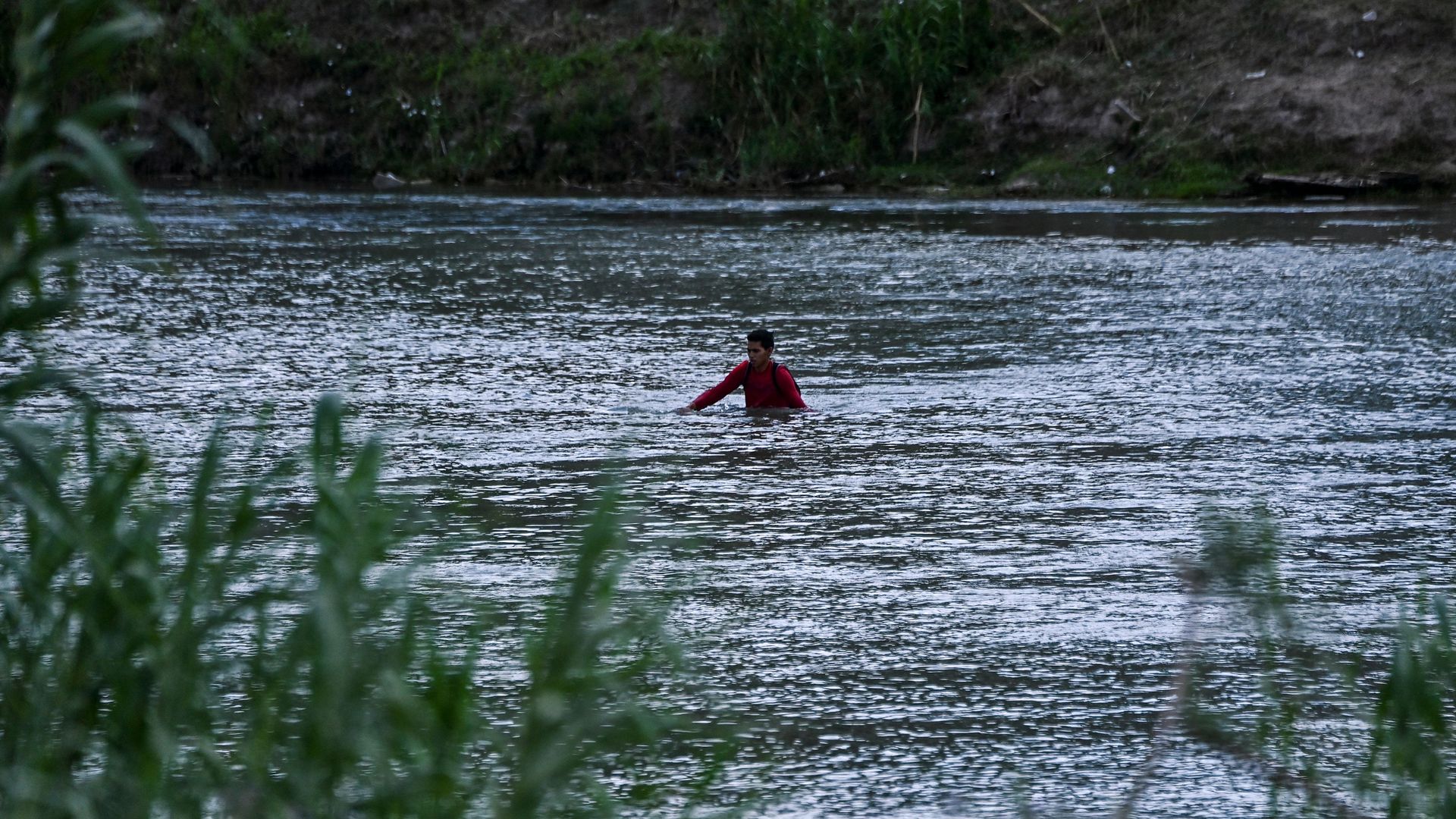 A migrant illegally crosses the Rio Grande River in Eagle Pass, Texas.