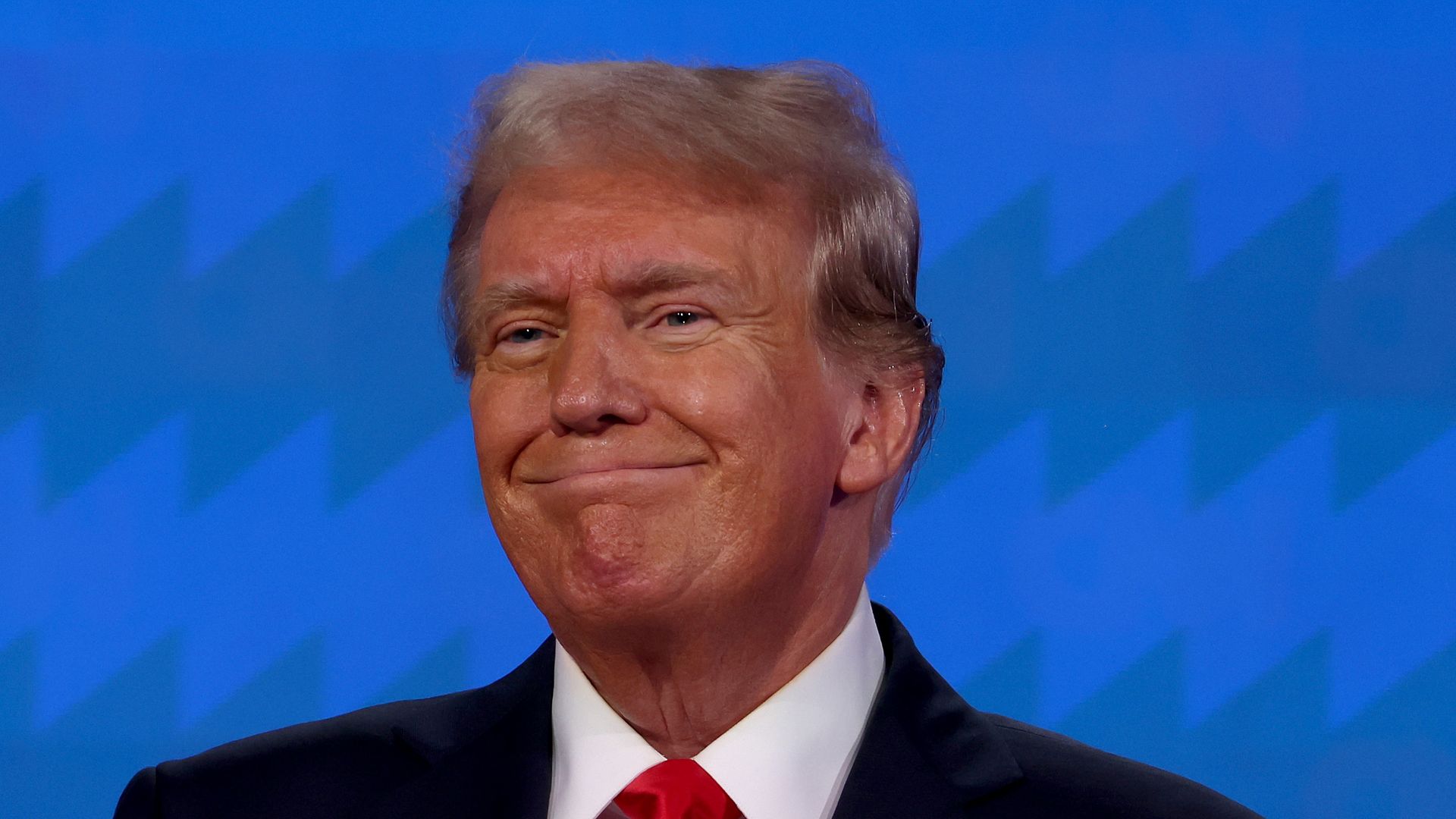 Donald Trump with a slight smile.