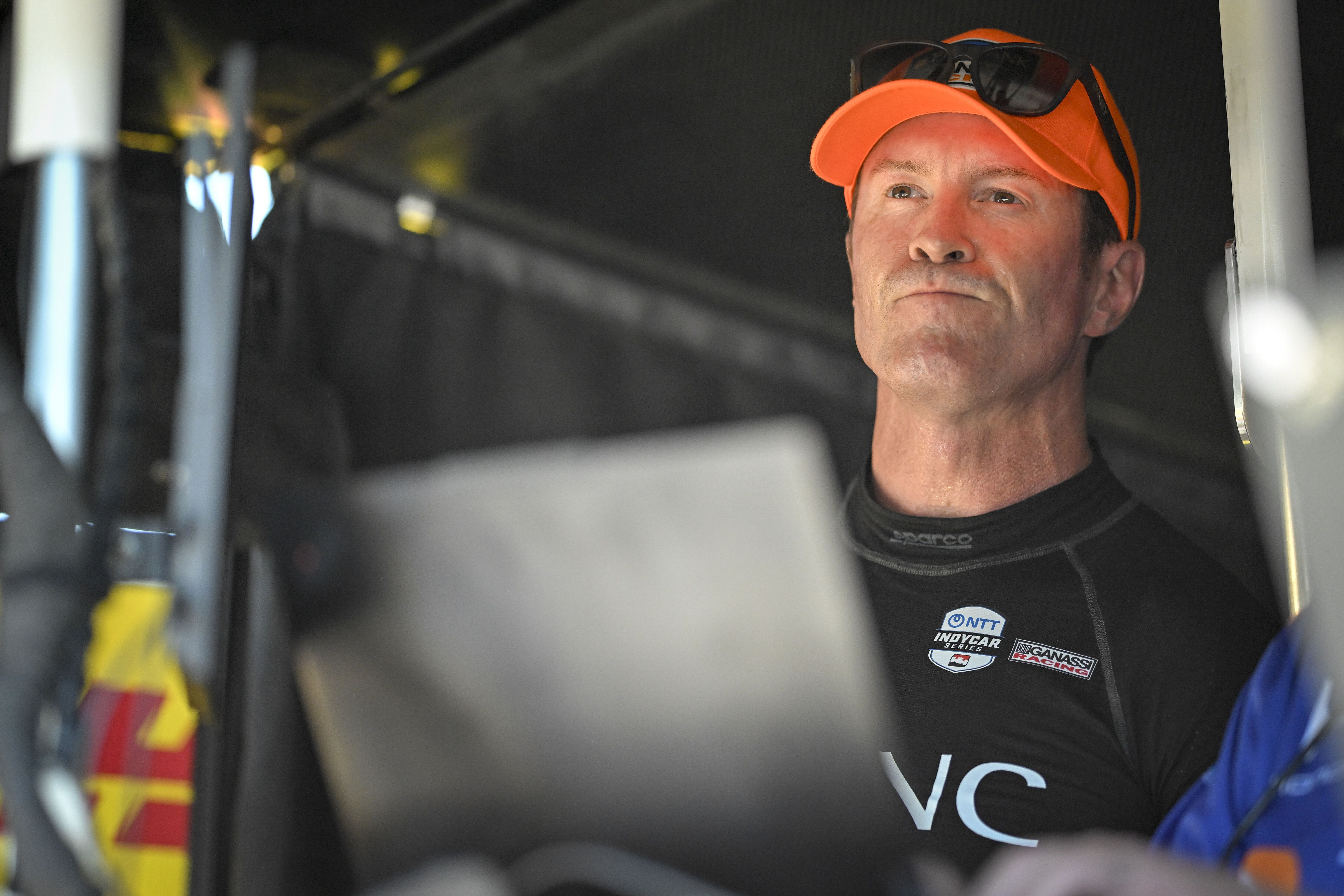 Scott Dixon wears an orange hat
