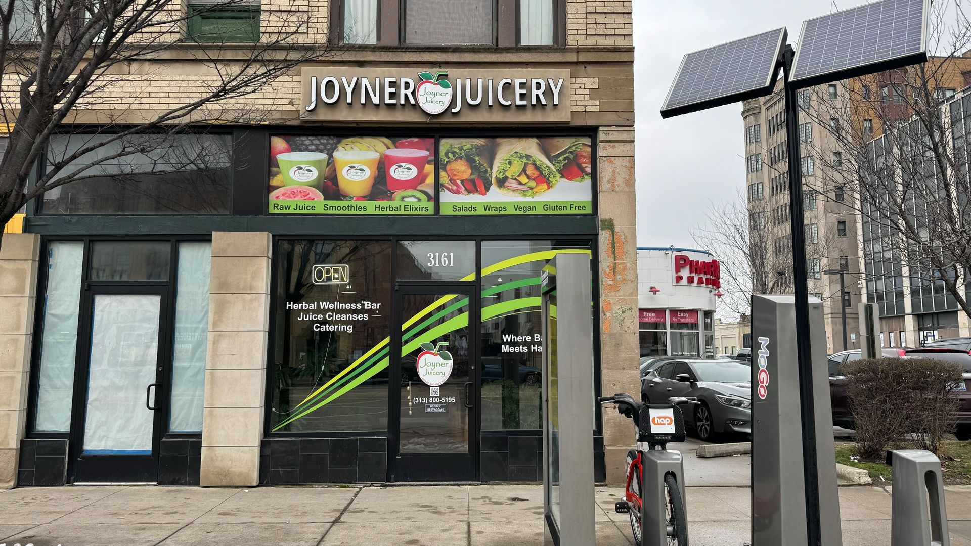 The storefront displays pictures of fresh juices.