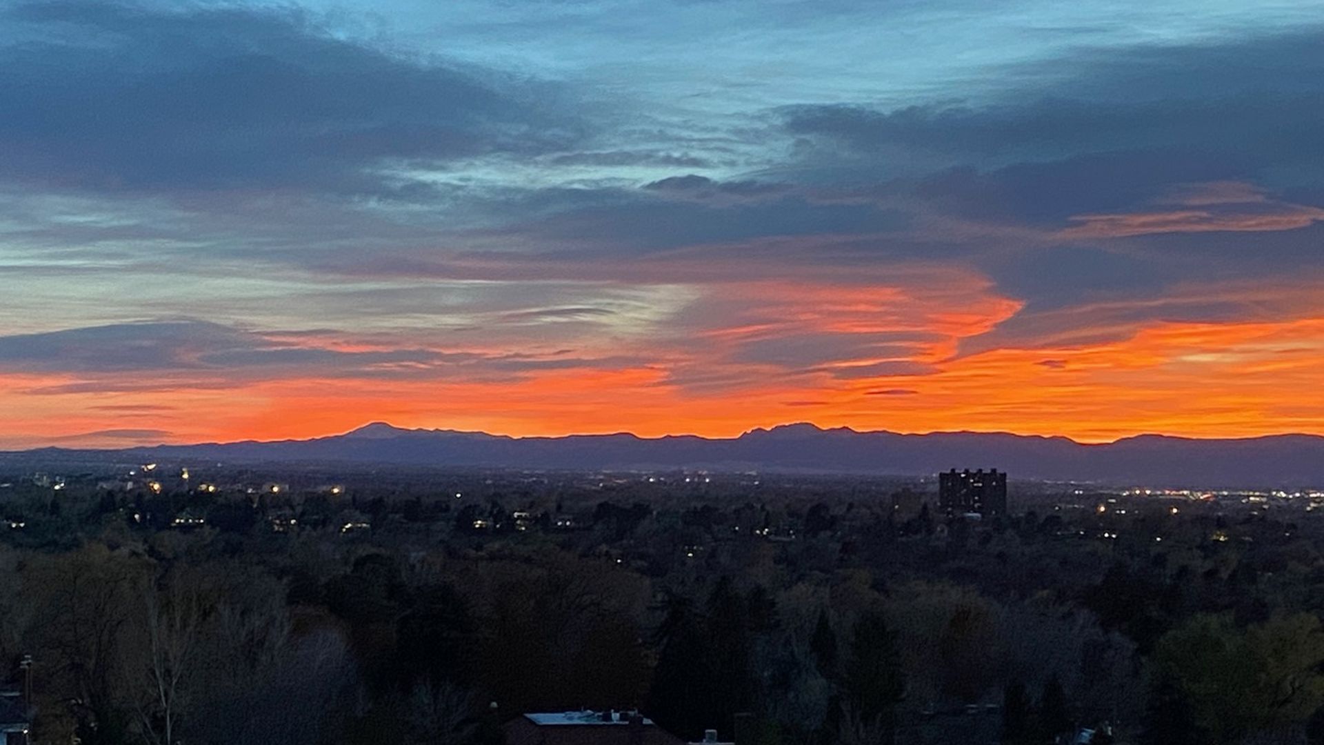 Smoke from wildfires clouds the sunset in Denver.