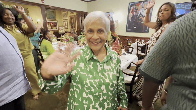 Stella Chase Reese waves at the camera.