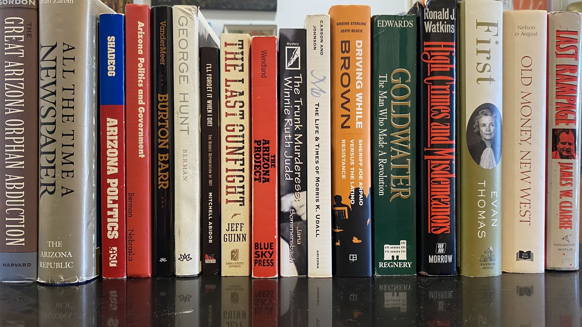 A row of Arizona history books lined up on a table. 