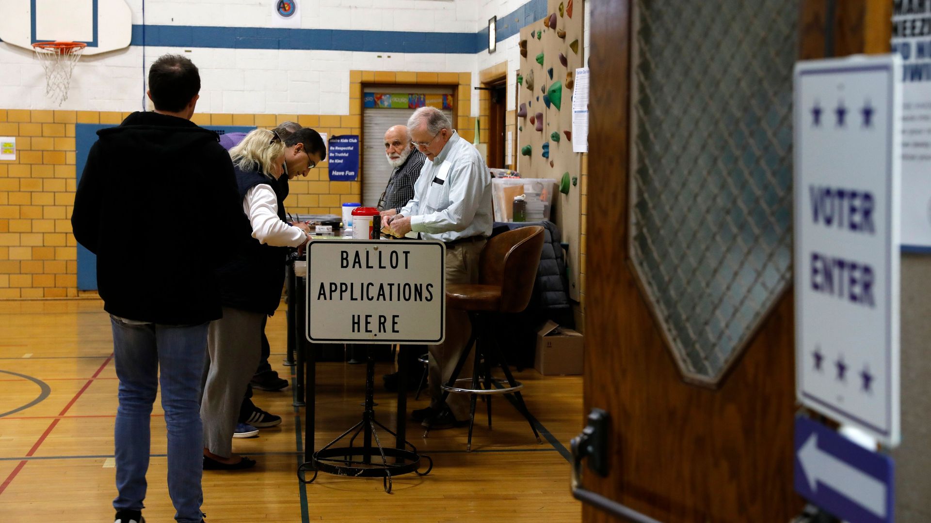 People vote in the Michigan primary election at an elementary school