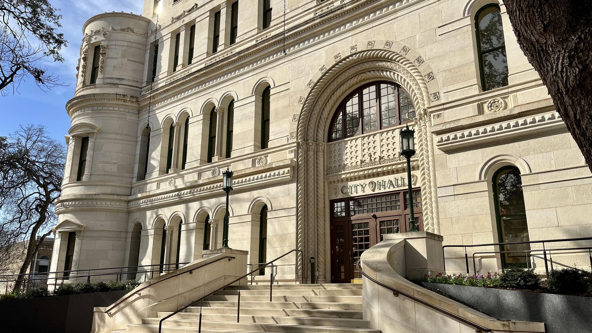 The renovated San Antonio City Hall pictured against a blue sky.