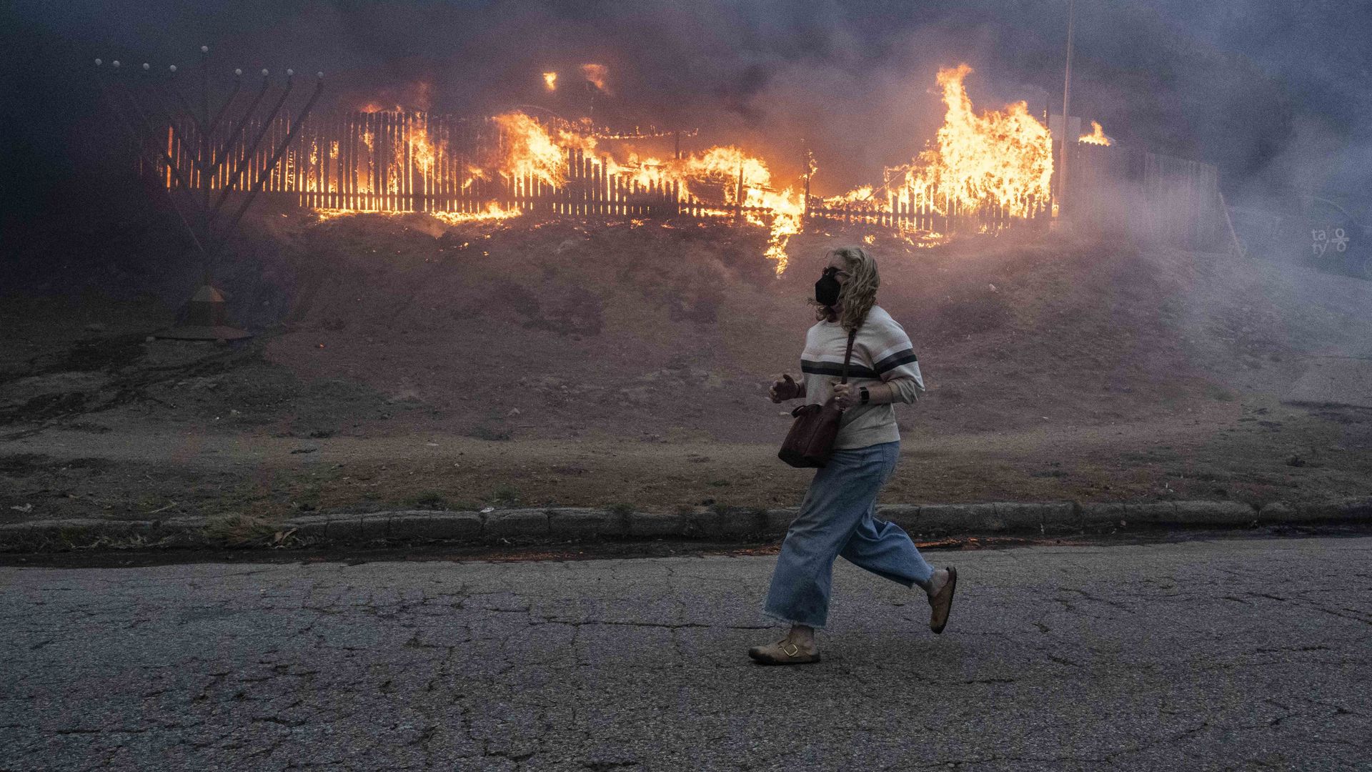 Torrance Firefighters are seen gearing up to fight the Palisades Fire, as residents try to escape.