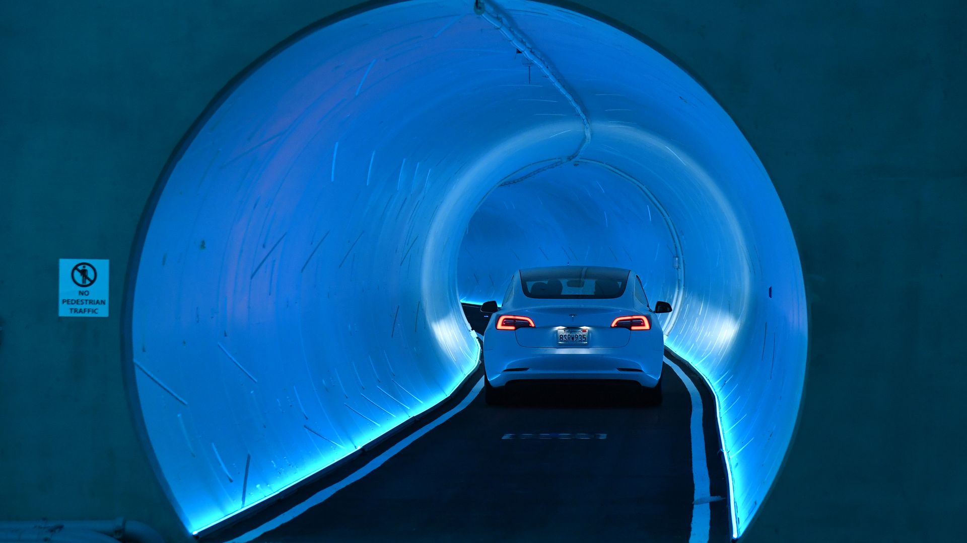 Image shows a Tesla in the Las Vegas tunnel.