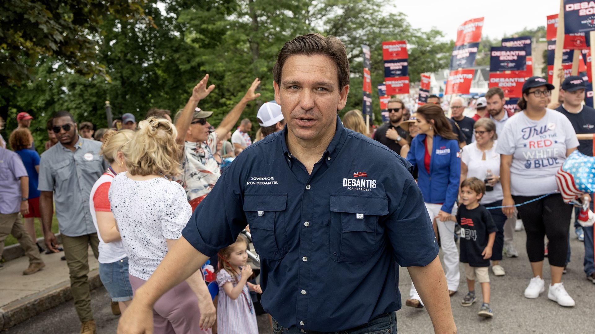 Republican presidential candidate, Florida Governor Ron DeSantis, joined by his wife Casey and their children, walks in a Fourth of July parade on July 4, 2023, in Wolfeboro, New Hampshire