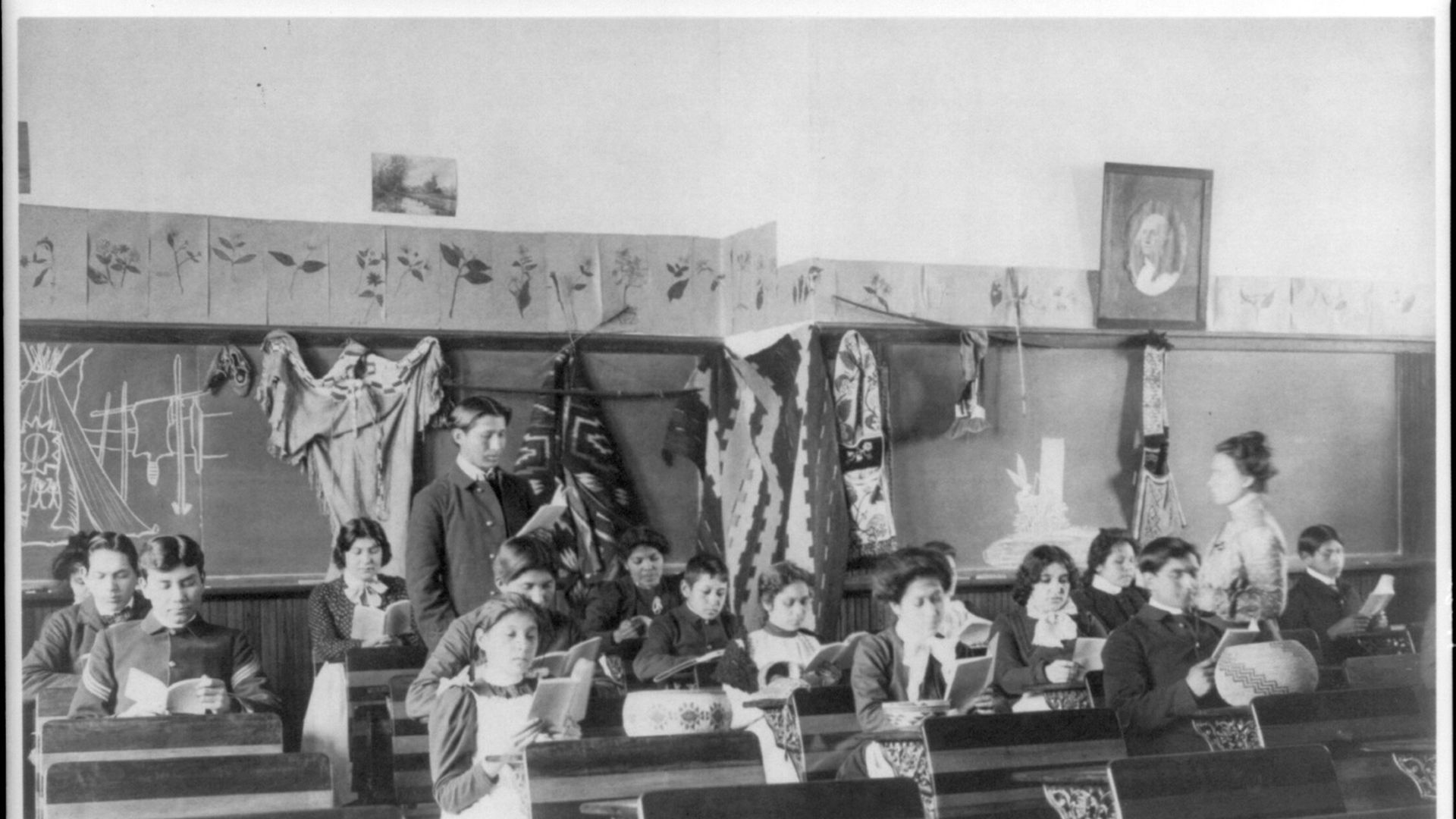 Male and female students reading in class, Carlisle Indian School, Carlisle, Pennsylvania, 1901.