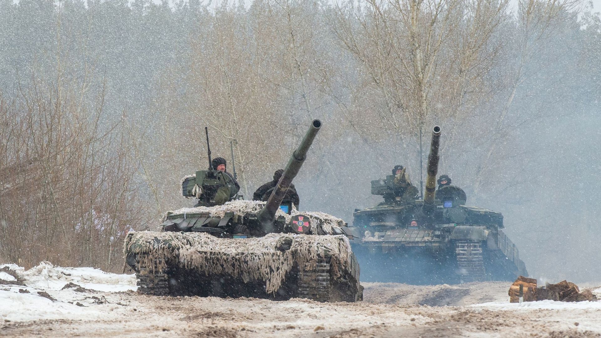 Ukrainian tanks are seen during live-fire drills on Thursday.