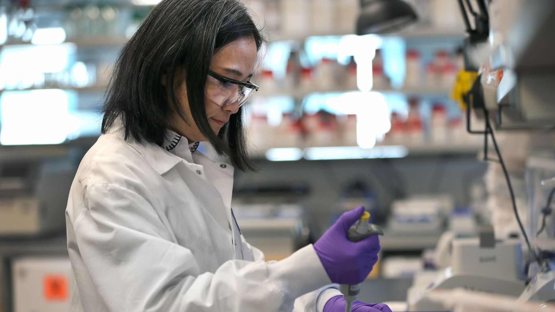 Scientist Xinhua Yan works in the lab at Moderna in Cambridge, MA on Feb. 28, 2020. 