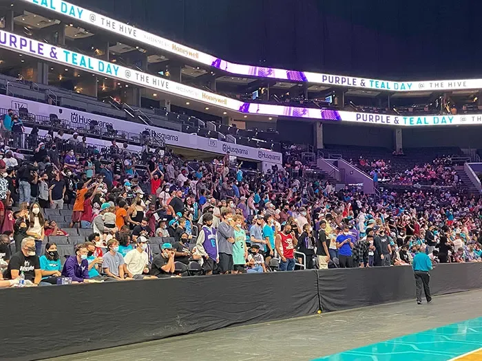 Fans at Hornets Purple & Teal day. 