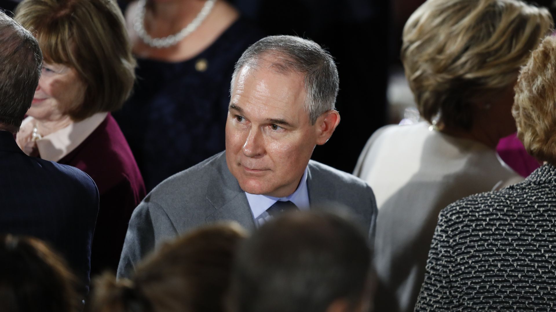 EPA administrator Scott Pruitt looks over his shoulder in a crowd