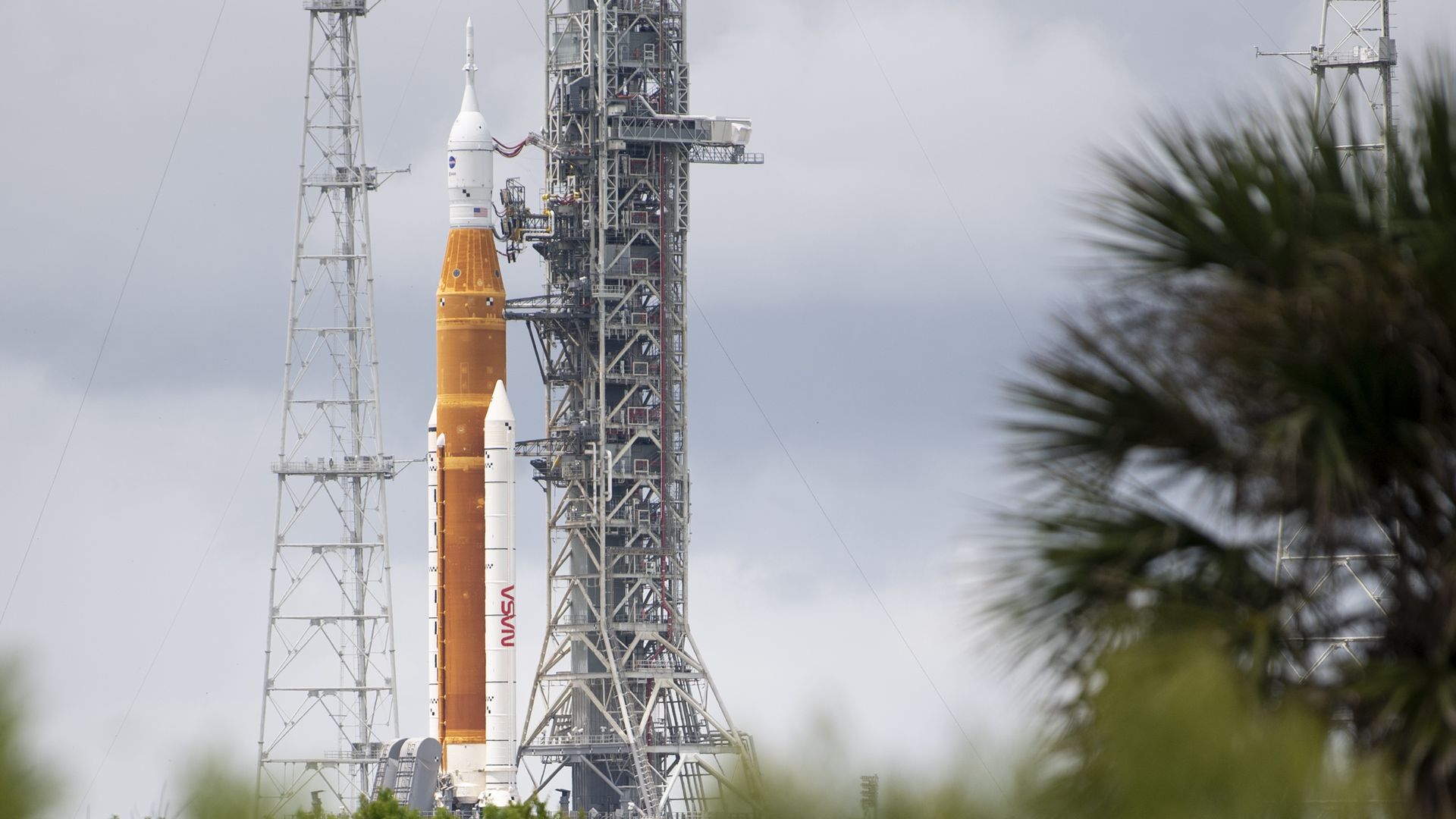 NASA's Space Launch System (SLS) rocket with the Orion spacecraft aboard is seen atop a mobile launcher.