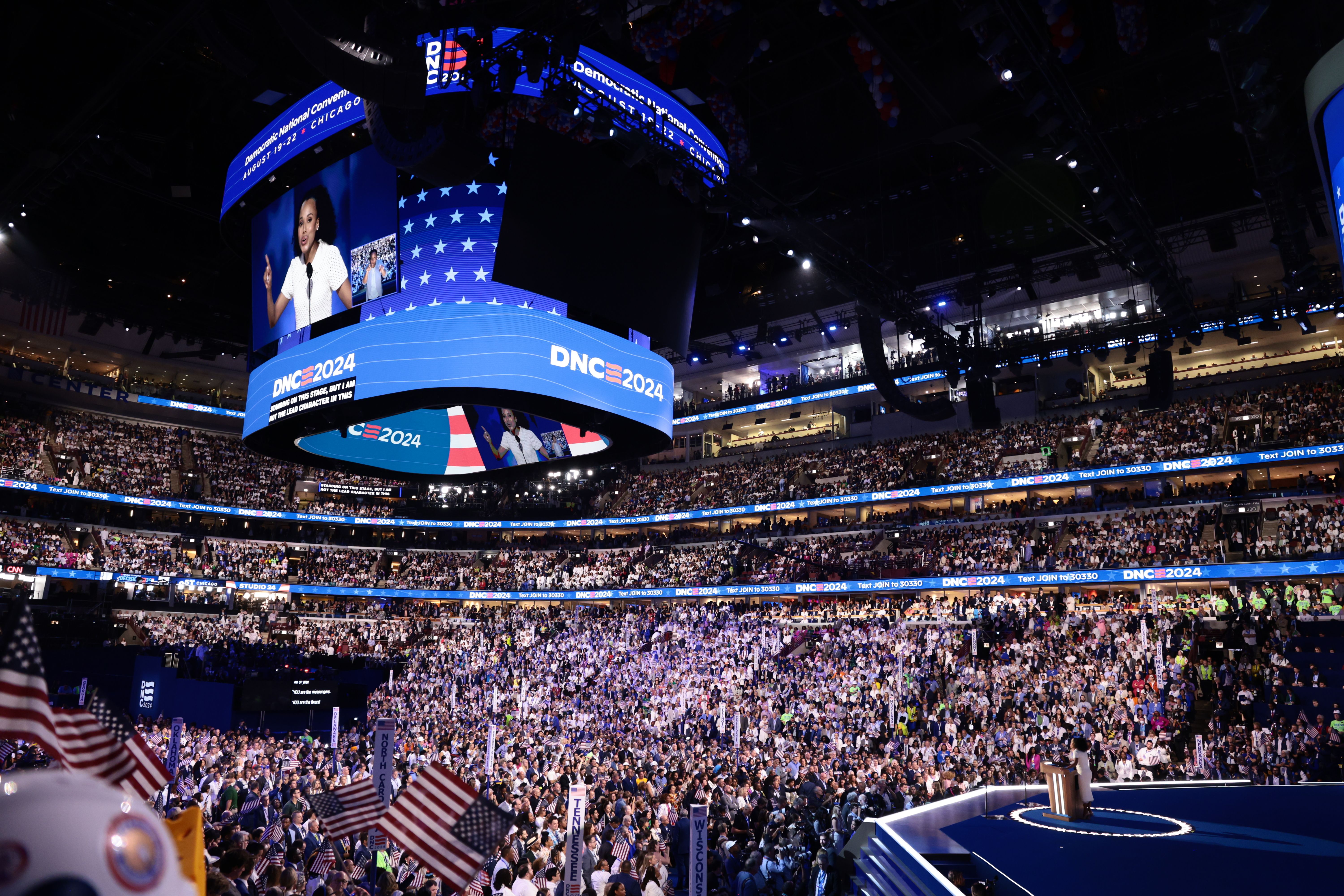DNC attendees watch actor Kerry Washington speaking on Aug. 22.