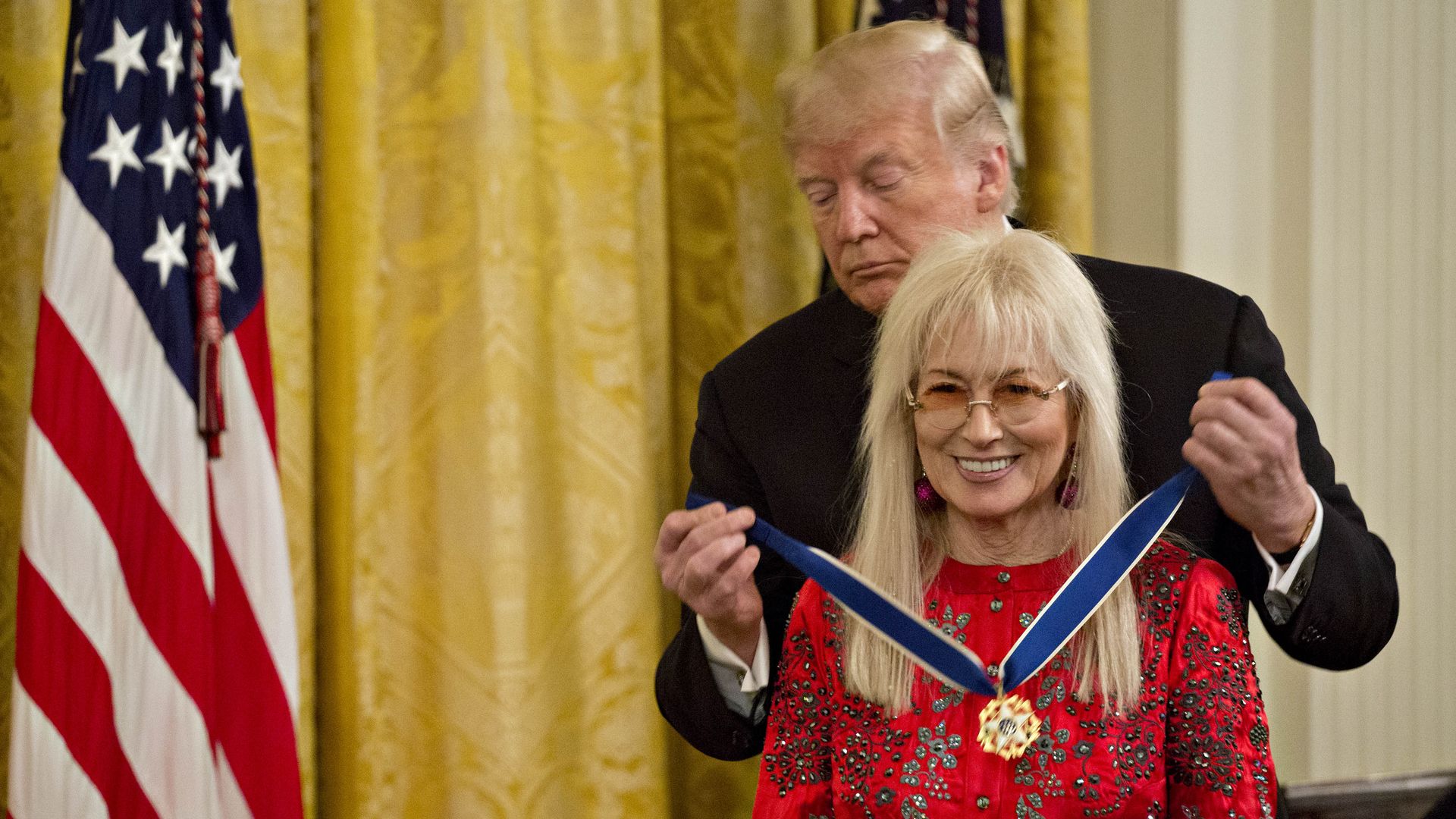 Former President Trump is seen presenting the Presidential Medal of Freedom to Miriam Adelson in 2018.