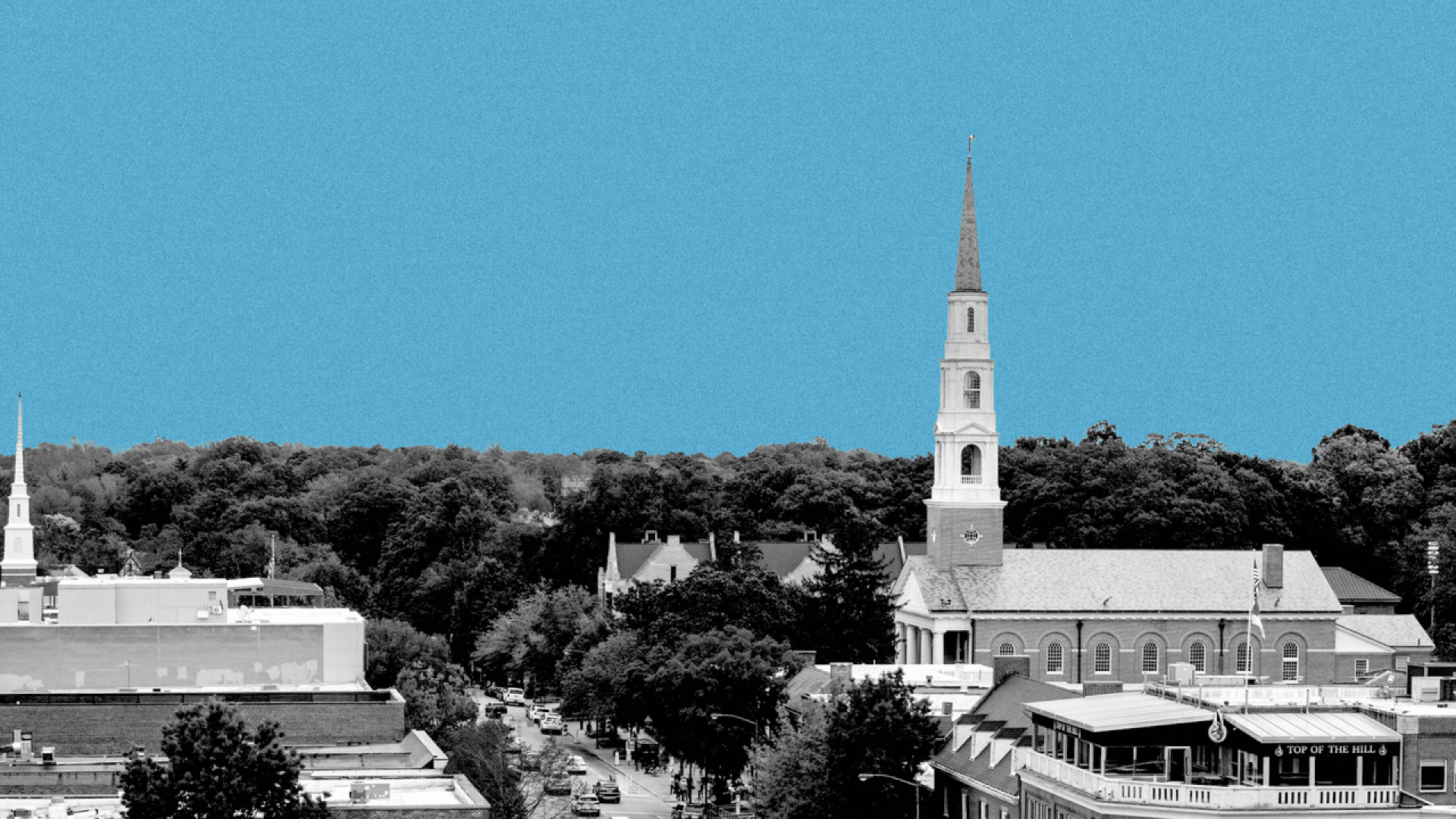 Photo illustration of the sun and moon transitioning over the Chapel Hill skyline.