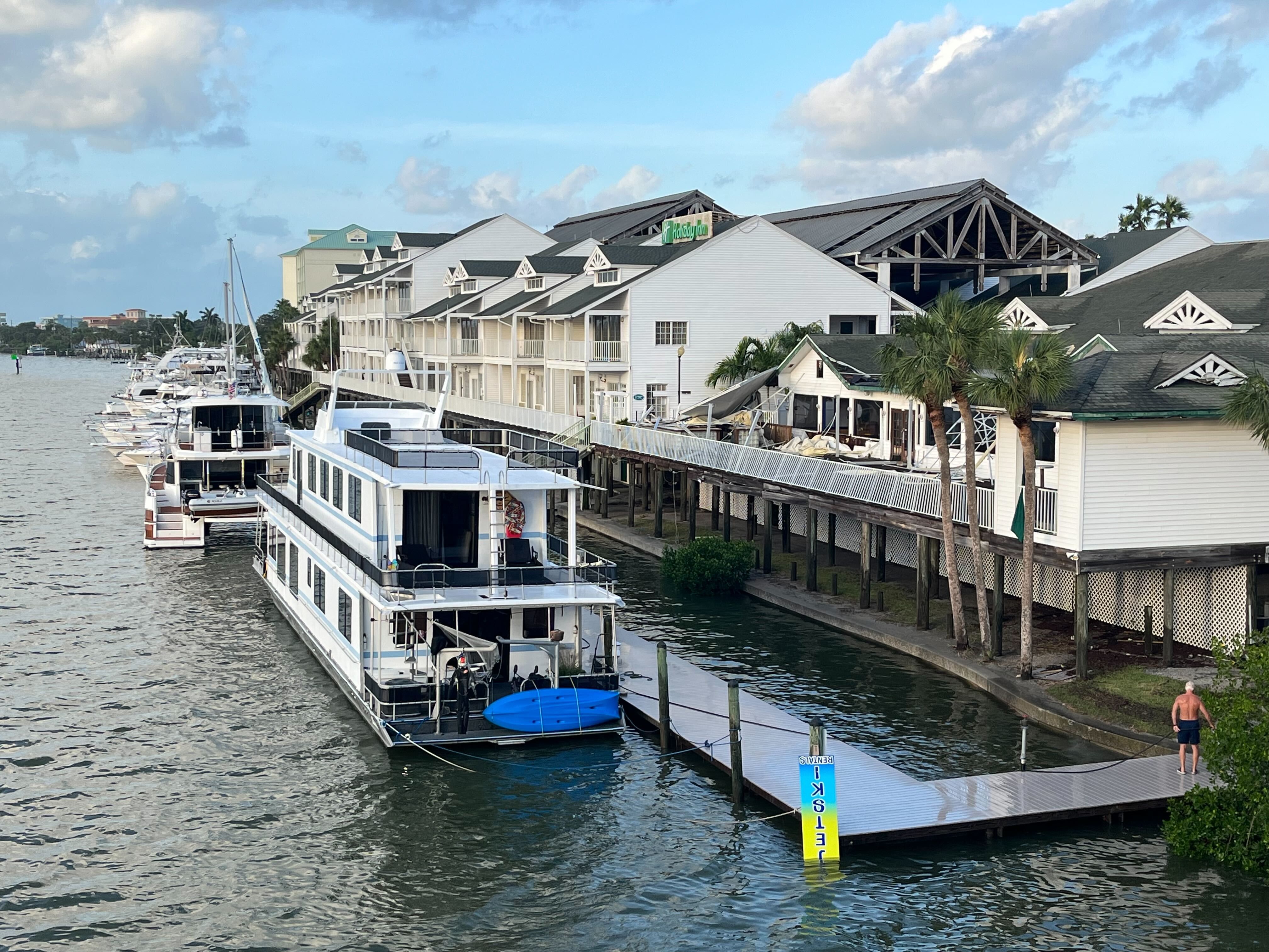 The Holiday Inn on the Intracoastal Waterway shows a caved in roof and high waters.
