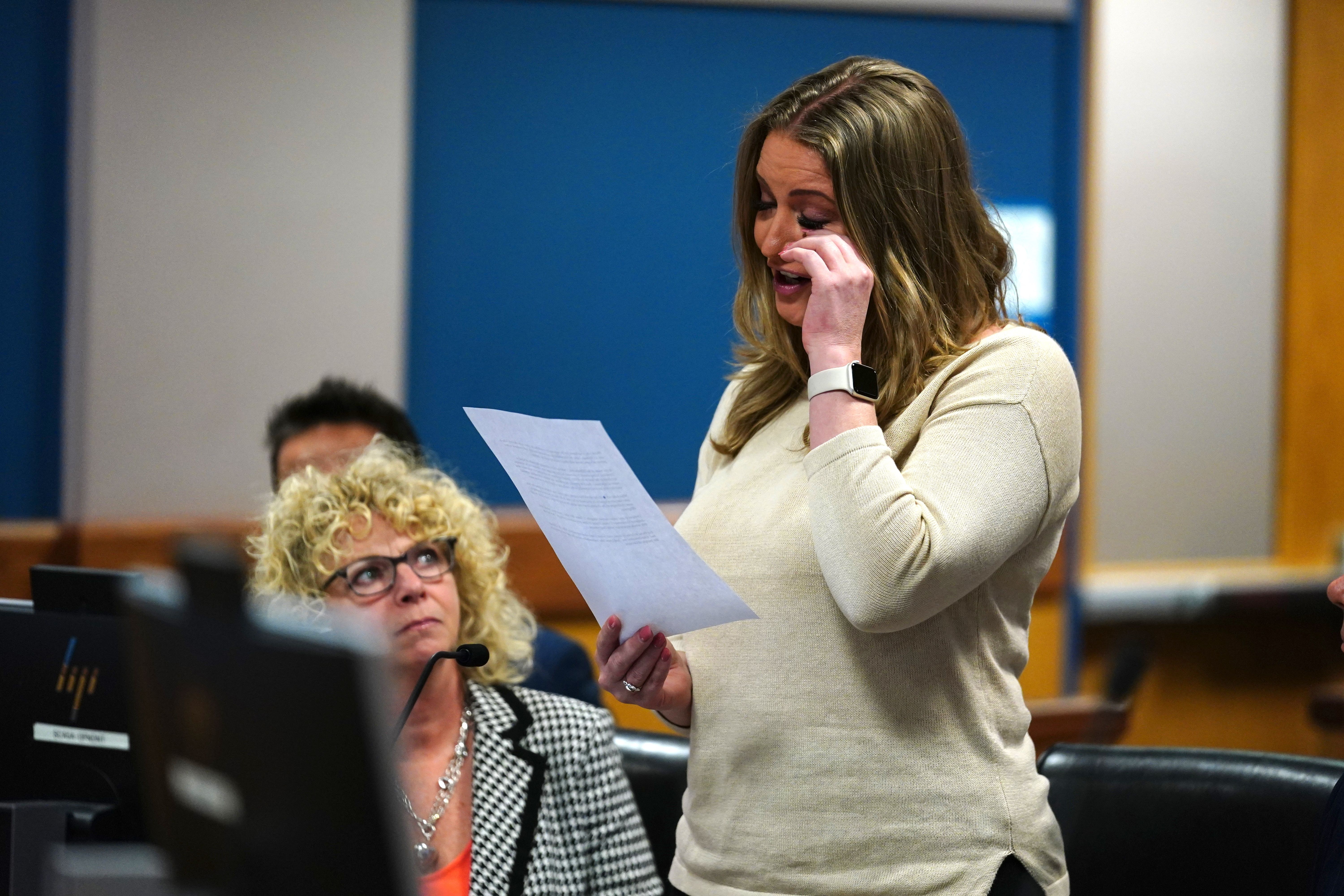 Jenna Ellis reads a statement after pleading guilty to a felony count of aiding and abetting false statements and writings, inside Fulton Superior Court Judge Scott McAfee's Fulton County Courtroom.