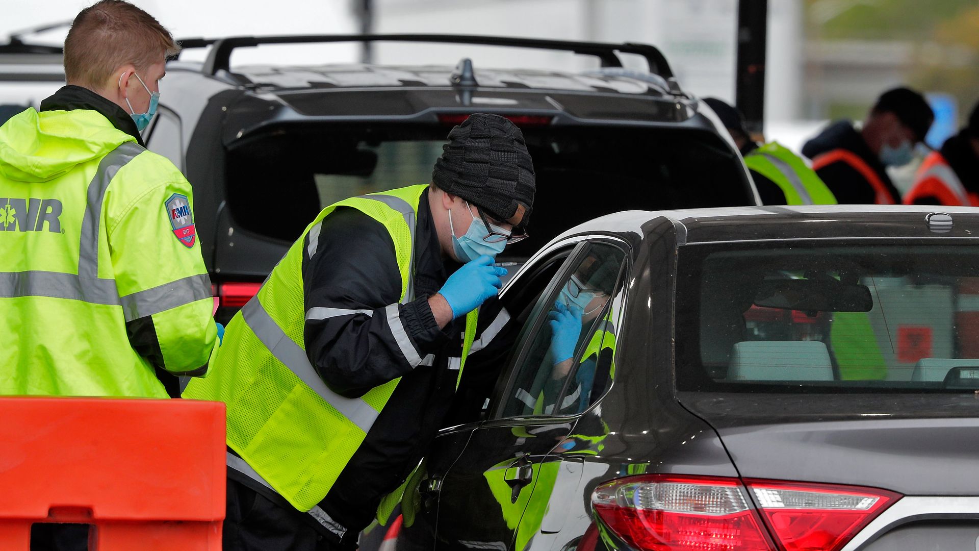 A health care worker administering a coronavirus vaccine at a mass vaccination site in Oakland, California, on Feb. 16.