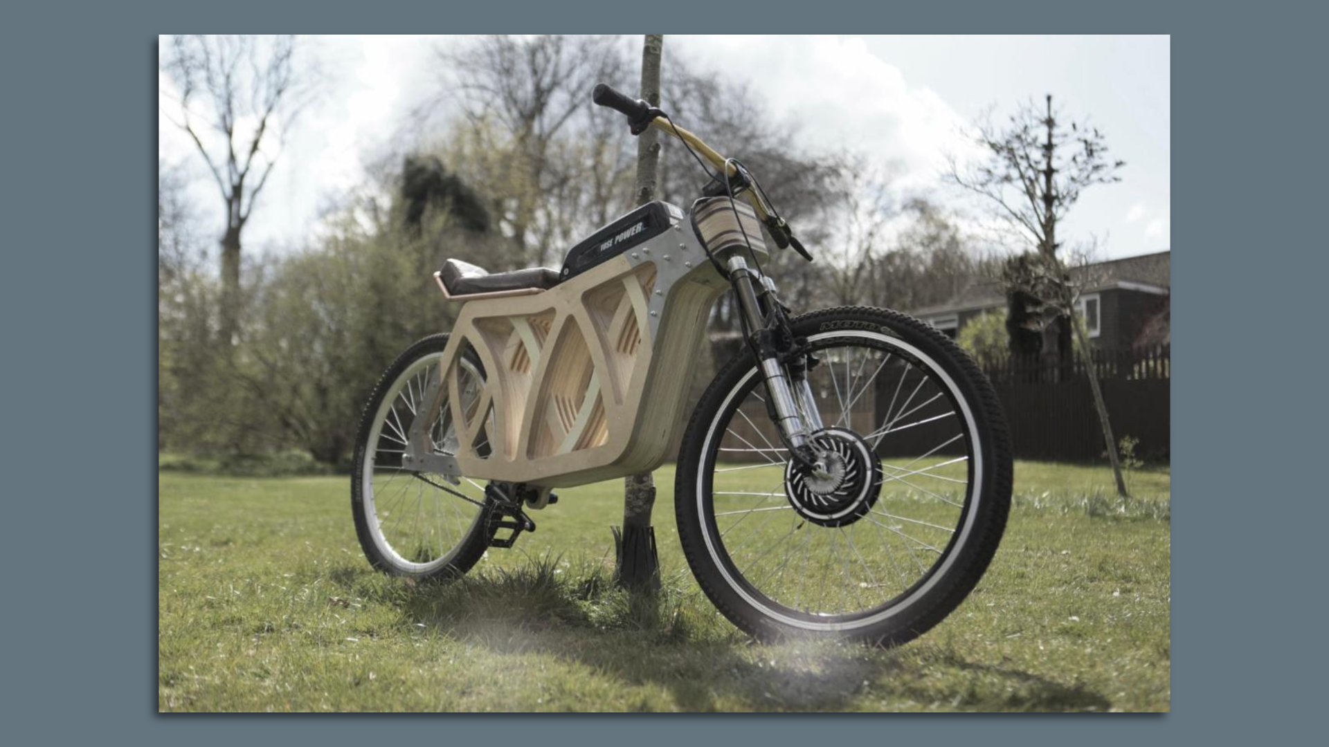 A model of an electric bike that has a wooden chassis.