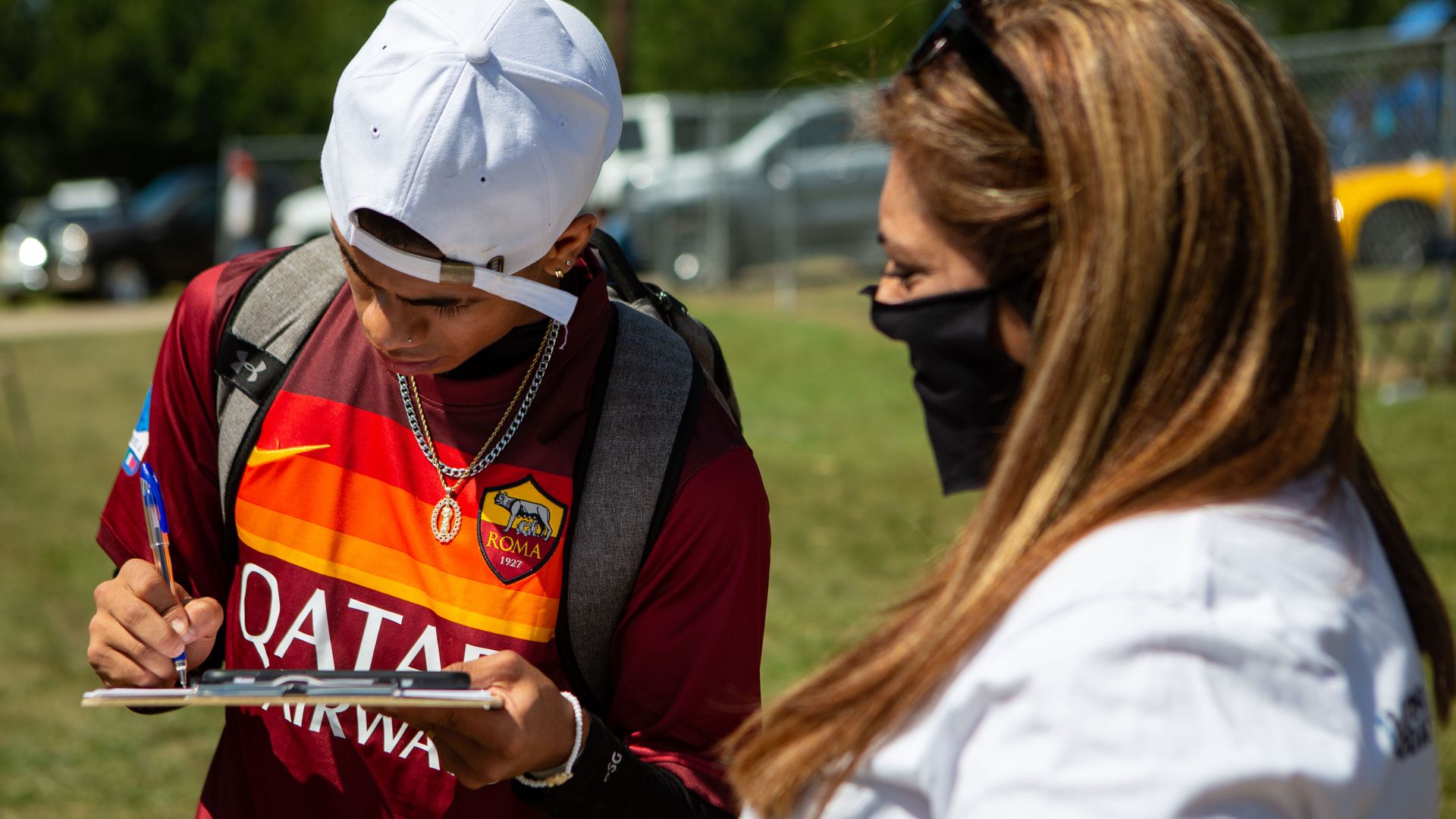 Sandra Amado Gomez registers a soccer player to vote during halftime at the championship game of soccer in Raleigh, North Carolina .