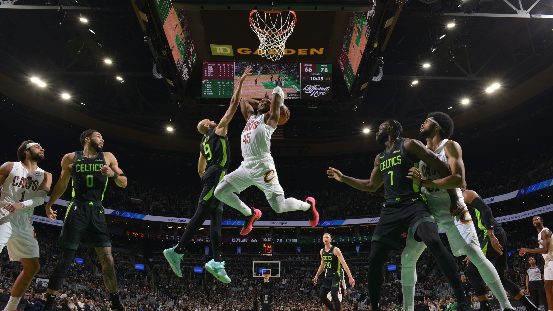 Cavs Donovan Mitchell mid air dunking on Celtics