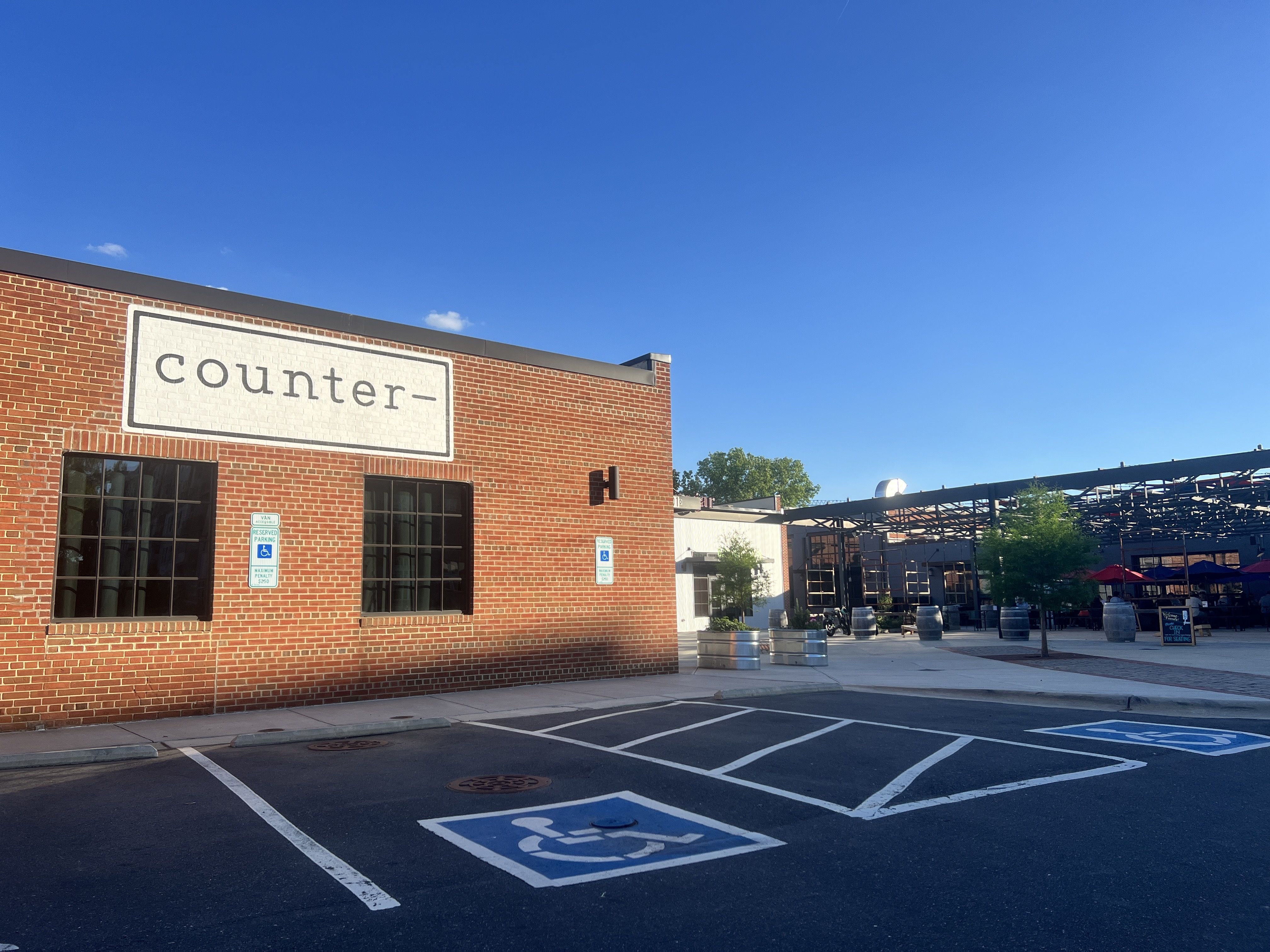 outside of brick building with sign that reads counter-