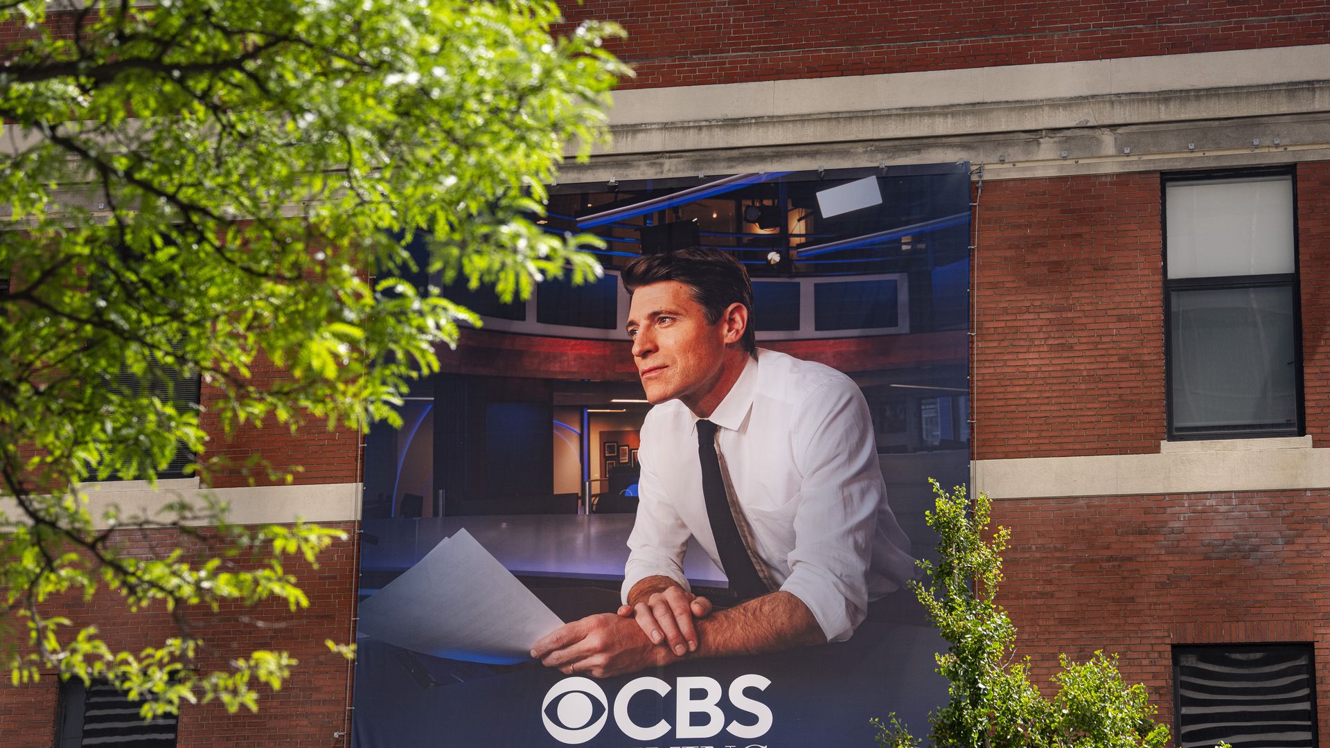 Tony Dokoupil, anchor of the "CBS Evening News," is emblazoned on a banner outside the CBS Broadcast Center in Manhattan. Photo: Al Drago/Getty Images