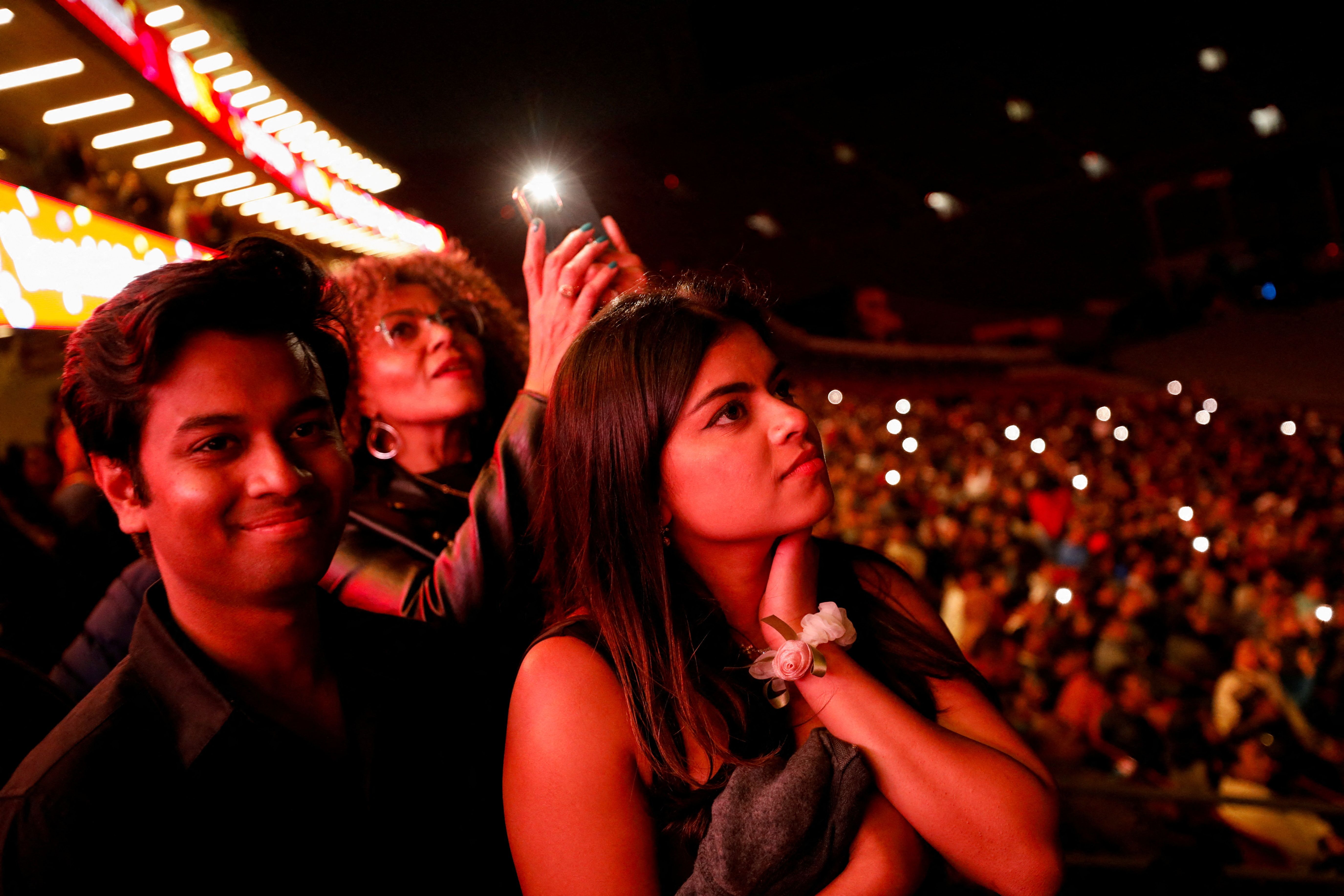University of Southern California (USC) seniors Archisman Sarkar and Poorvi Singh watch the drone and fireworks show during a "Trojan Family Graduate Celebration" hosted by USC, which previously cancelled its main stage commencement ceremony amid pro-Palestinian protests, at the Los Angeles Memorial Coliseum in Los Angeles, California, U.S., May 9, 2024.