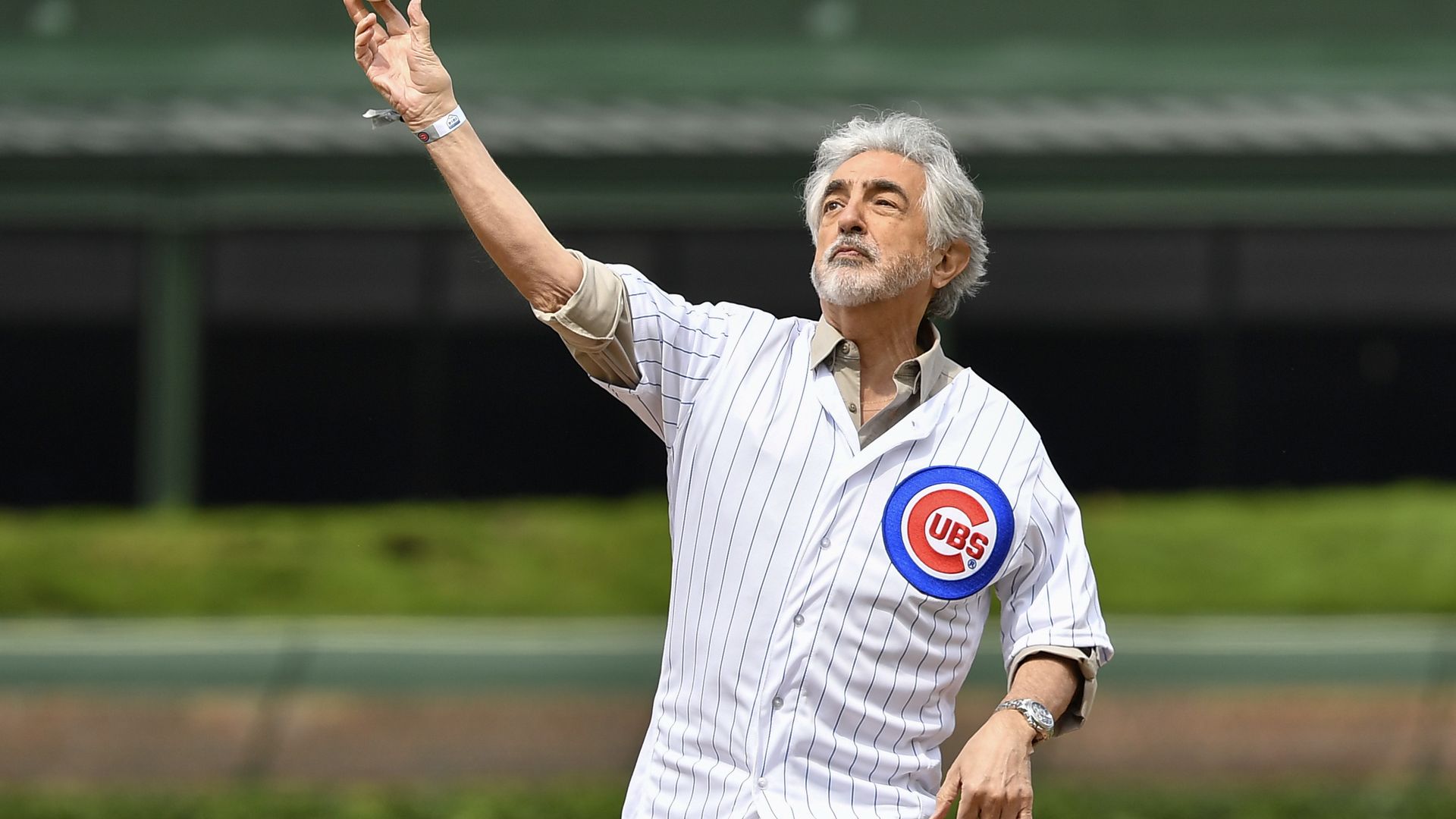 A photo of a man throwing a baseball.