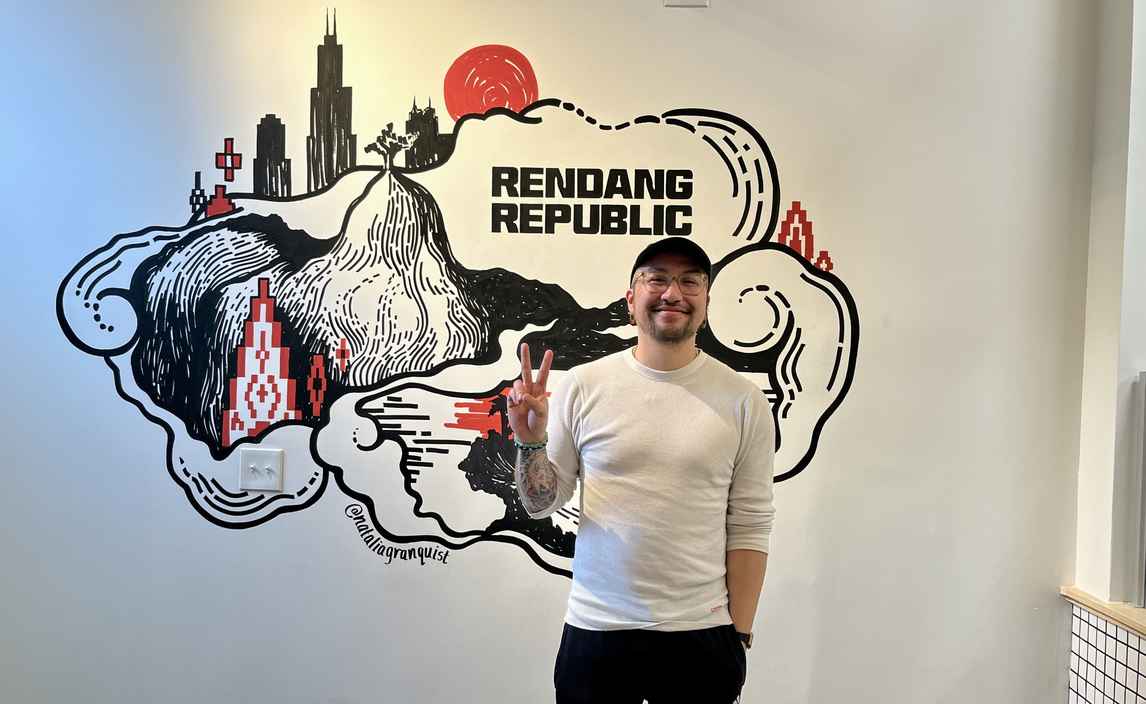 man standing next to wall 