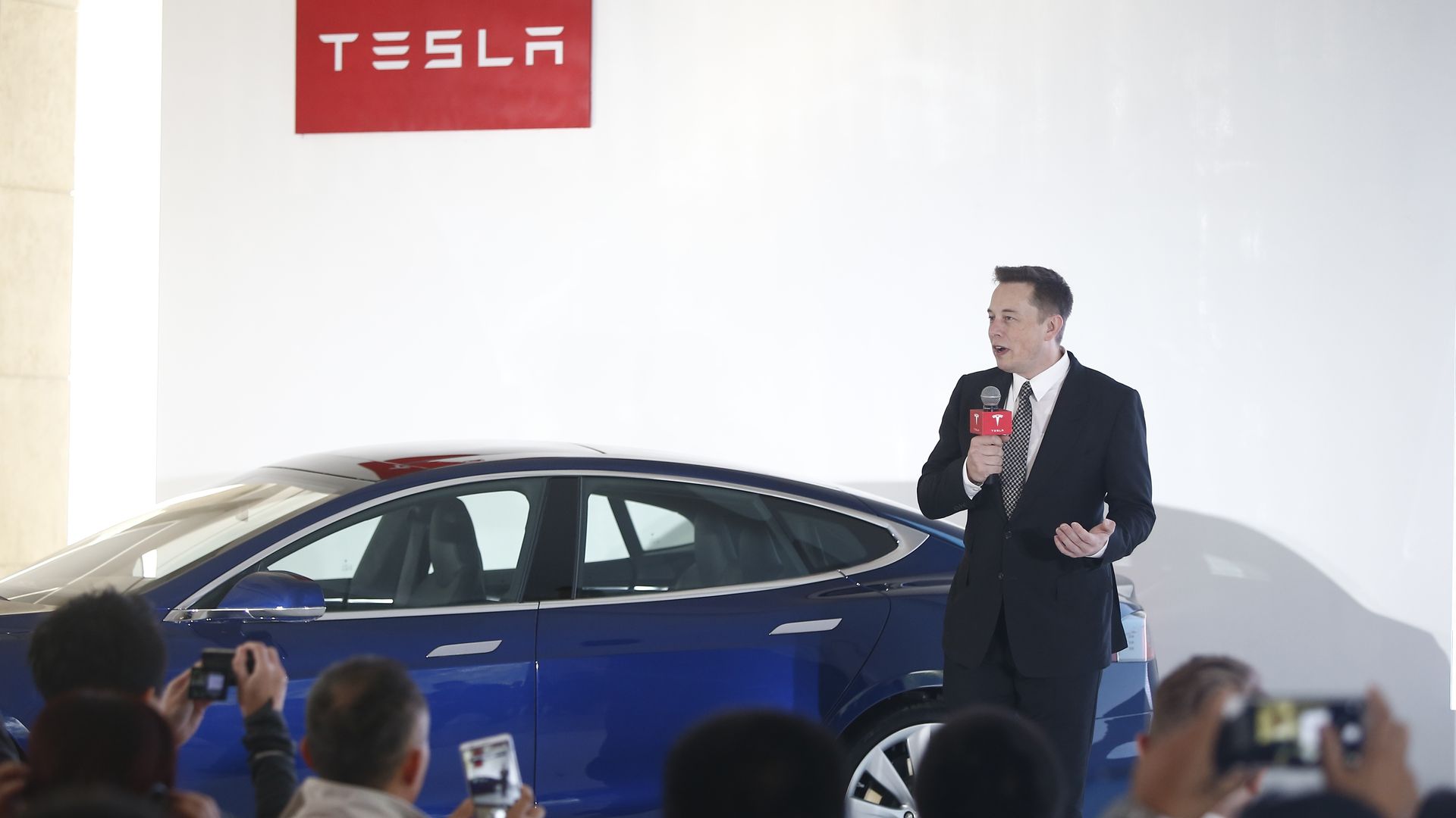 Elon Musk addressing reporters