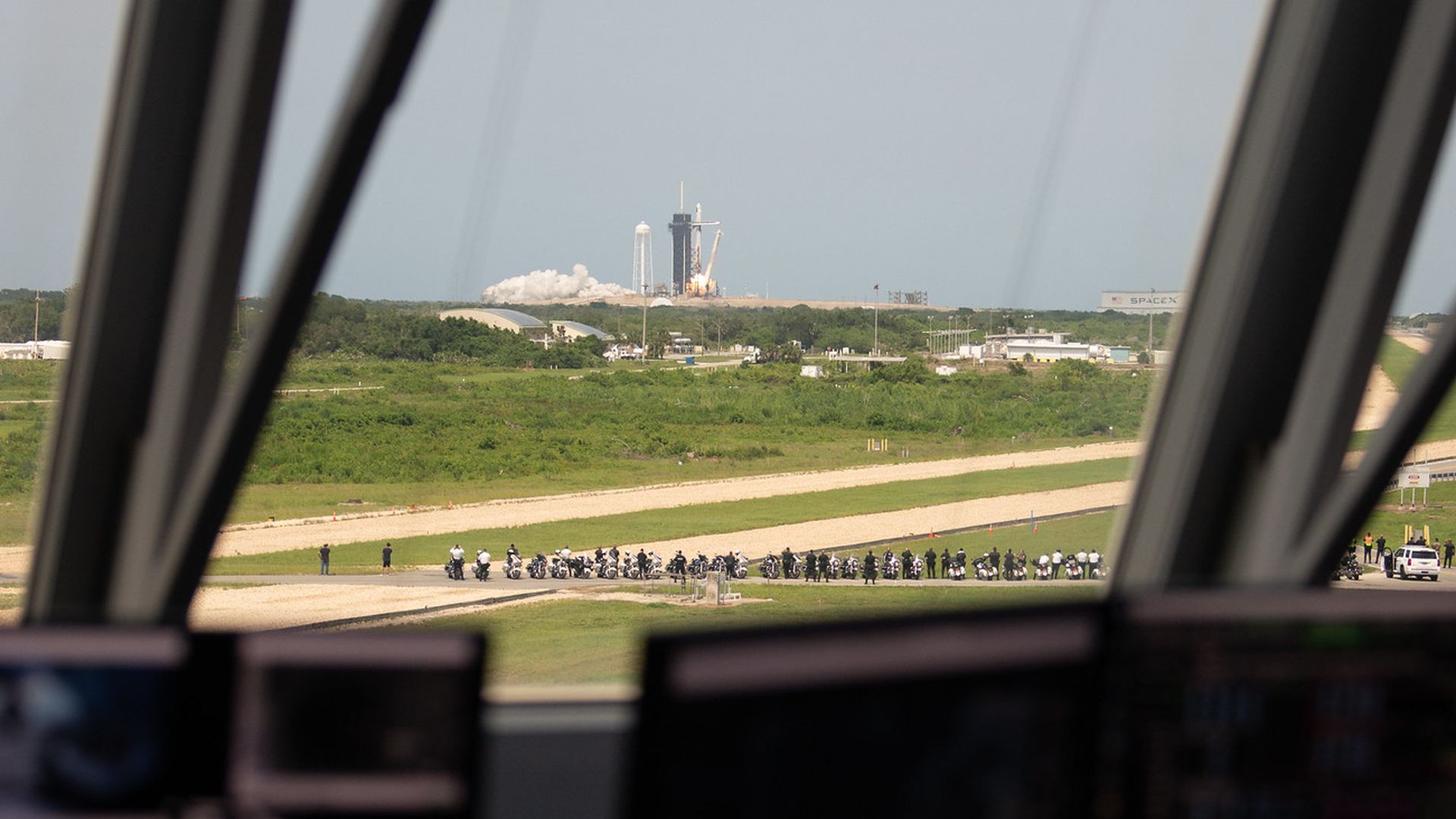 A Falcon 9 rocket launch seen from Mission Control.