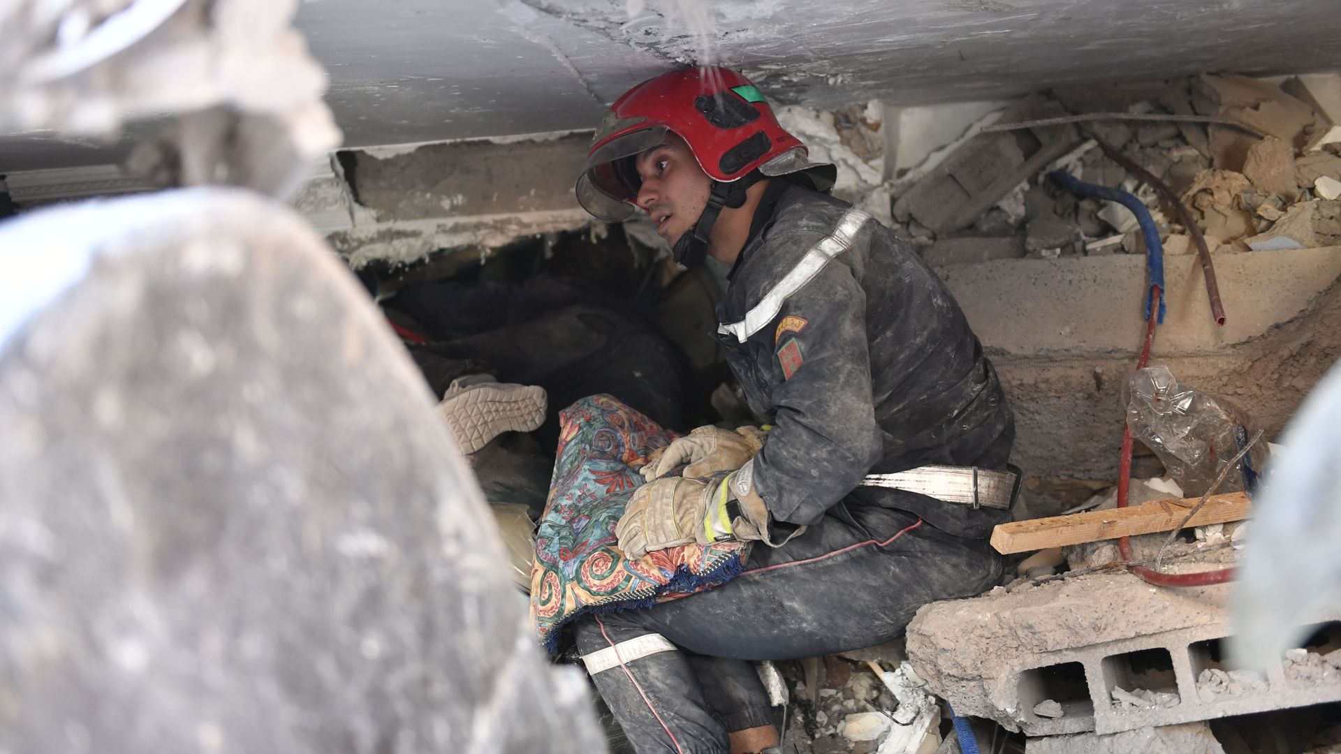 A rescue worker searches the debris in Morocco's Marrakech after a powerful quake struck the region. Photo: Abu Adem Muhammed/Anadolu Agency via Getty Images)