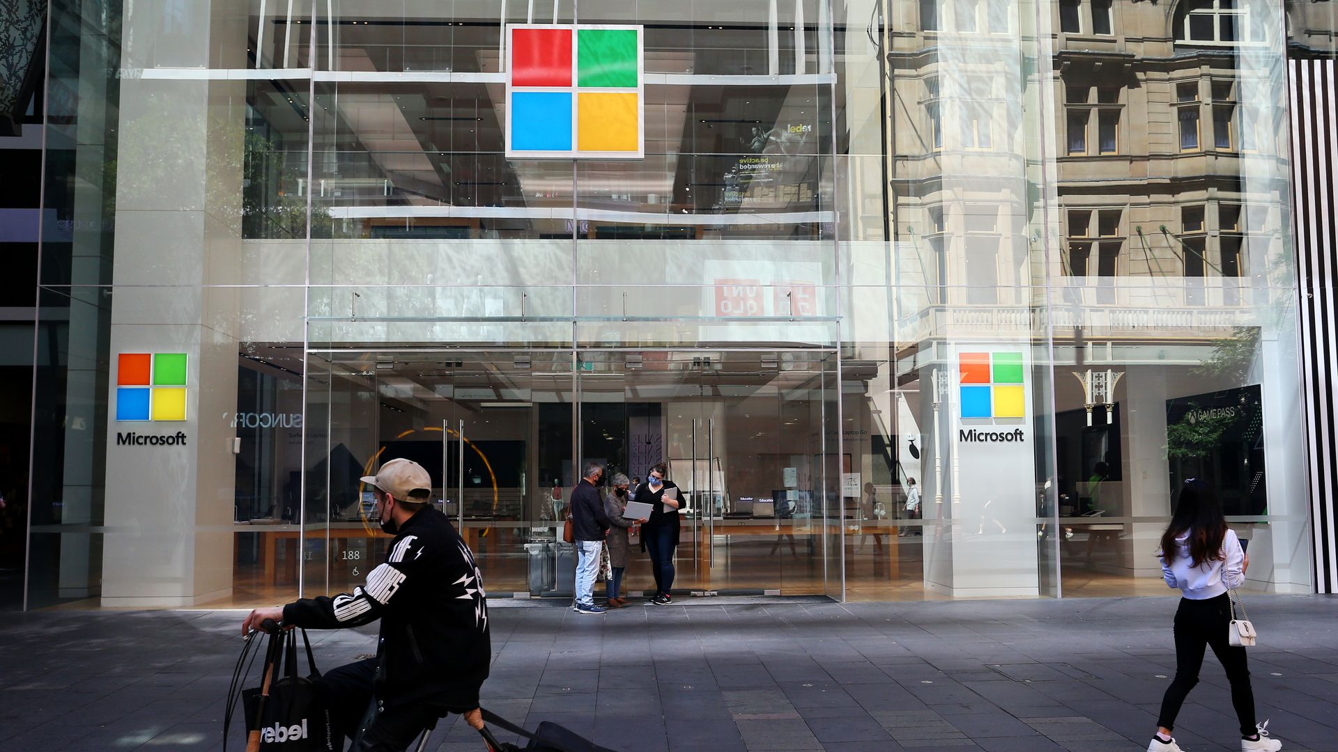 People outside of a Microsoft store in Sydney, Australia, on Oct. 18.