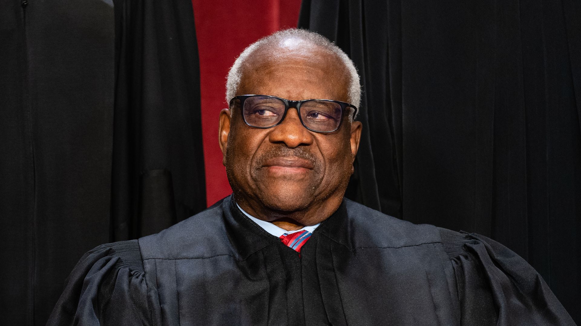 Clarence Thomas sits for a formal group photo