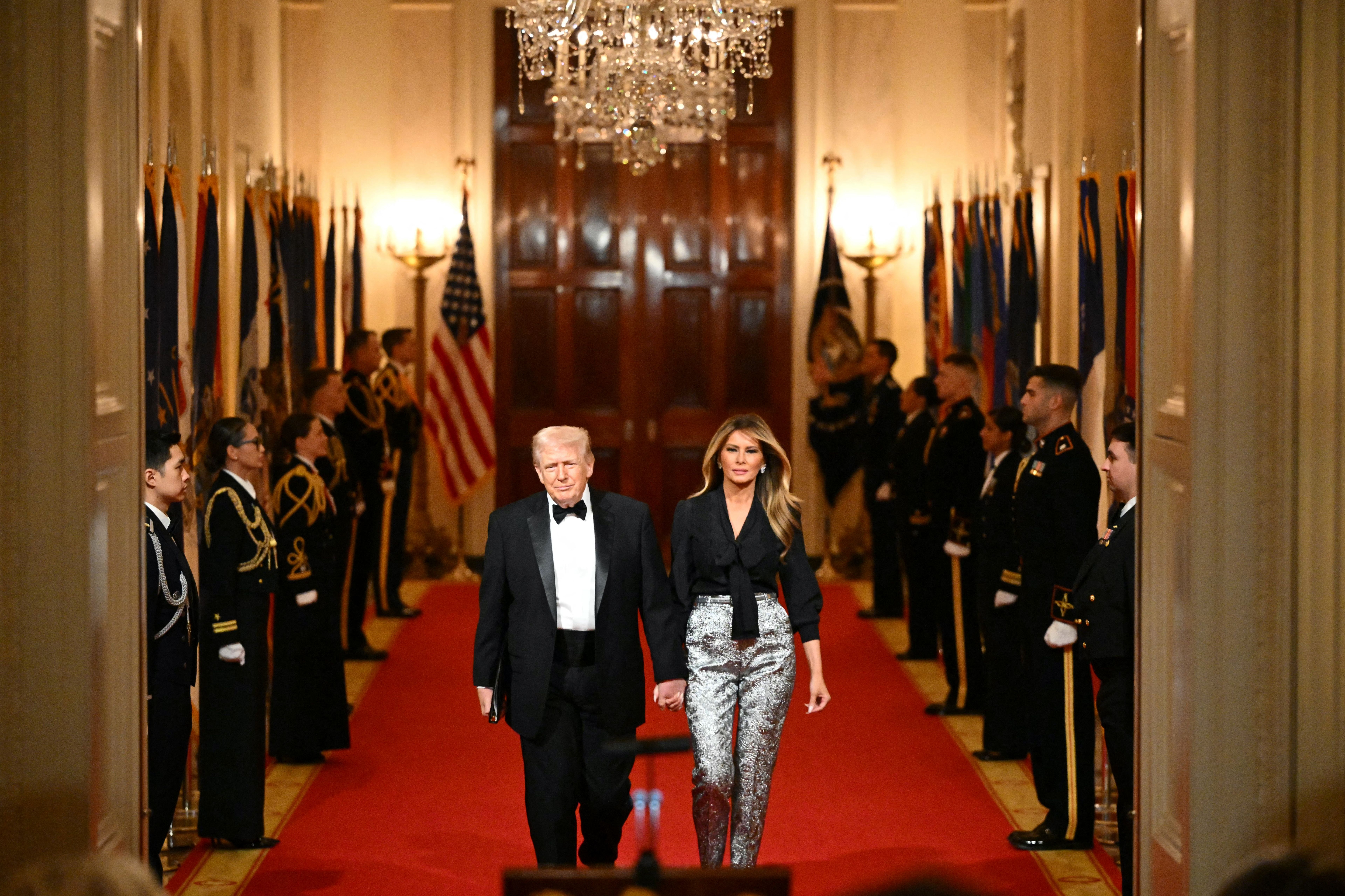 President Donald Trump and First Lady Melania Trump attend a dinner with state governors in the East Room of the White House on February 21, 2026. (Photo by Mandel NGAN / AFP via Getty Images)
