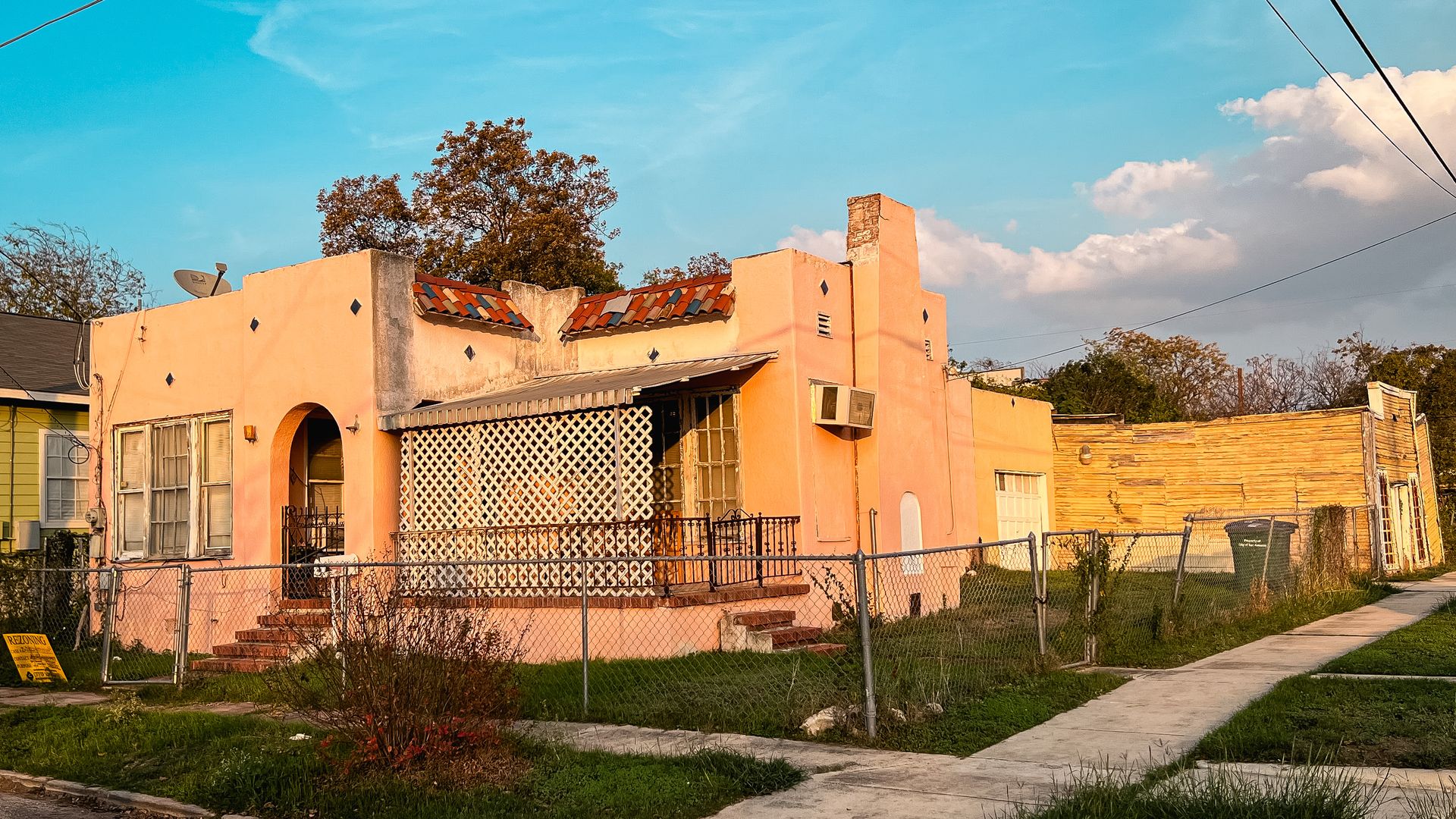 230 Cactus is shown in the forefront with the deteriorating grocery store in the background. 