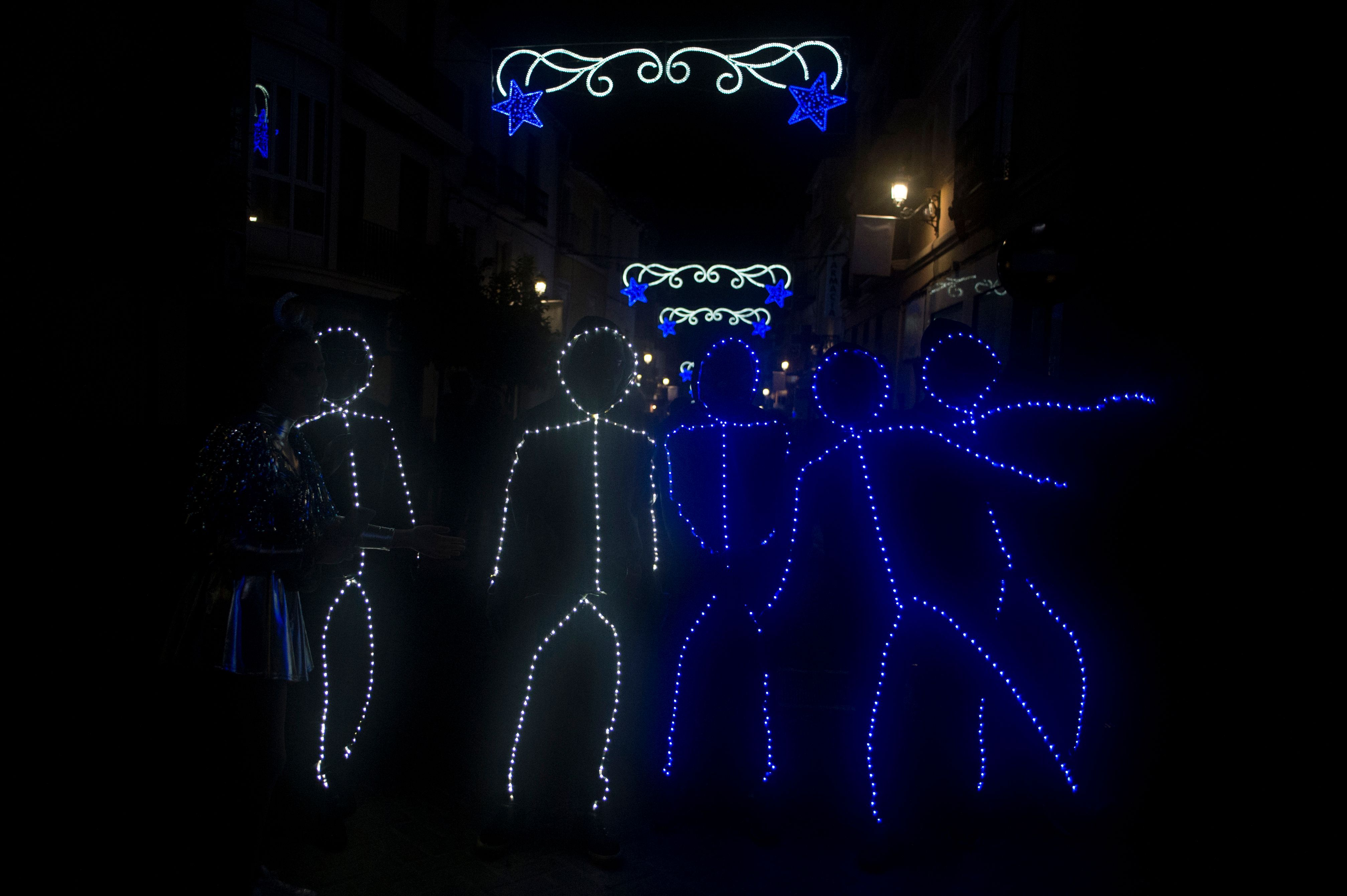 People in light-costumes welcome the new year in Coin, near Malaga, Spain, on January 1
